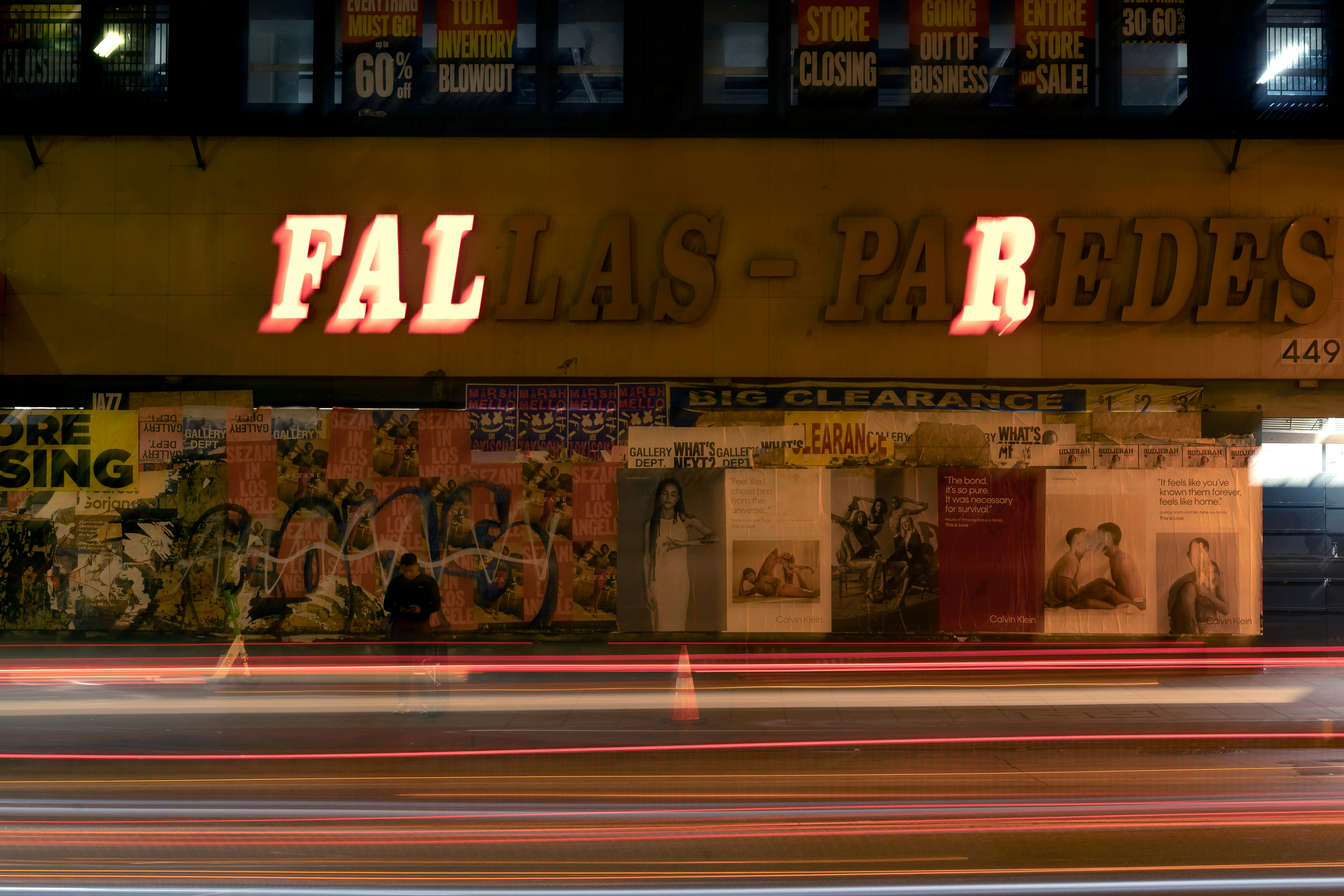 Neon sign above records store at night