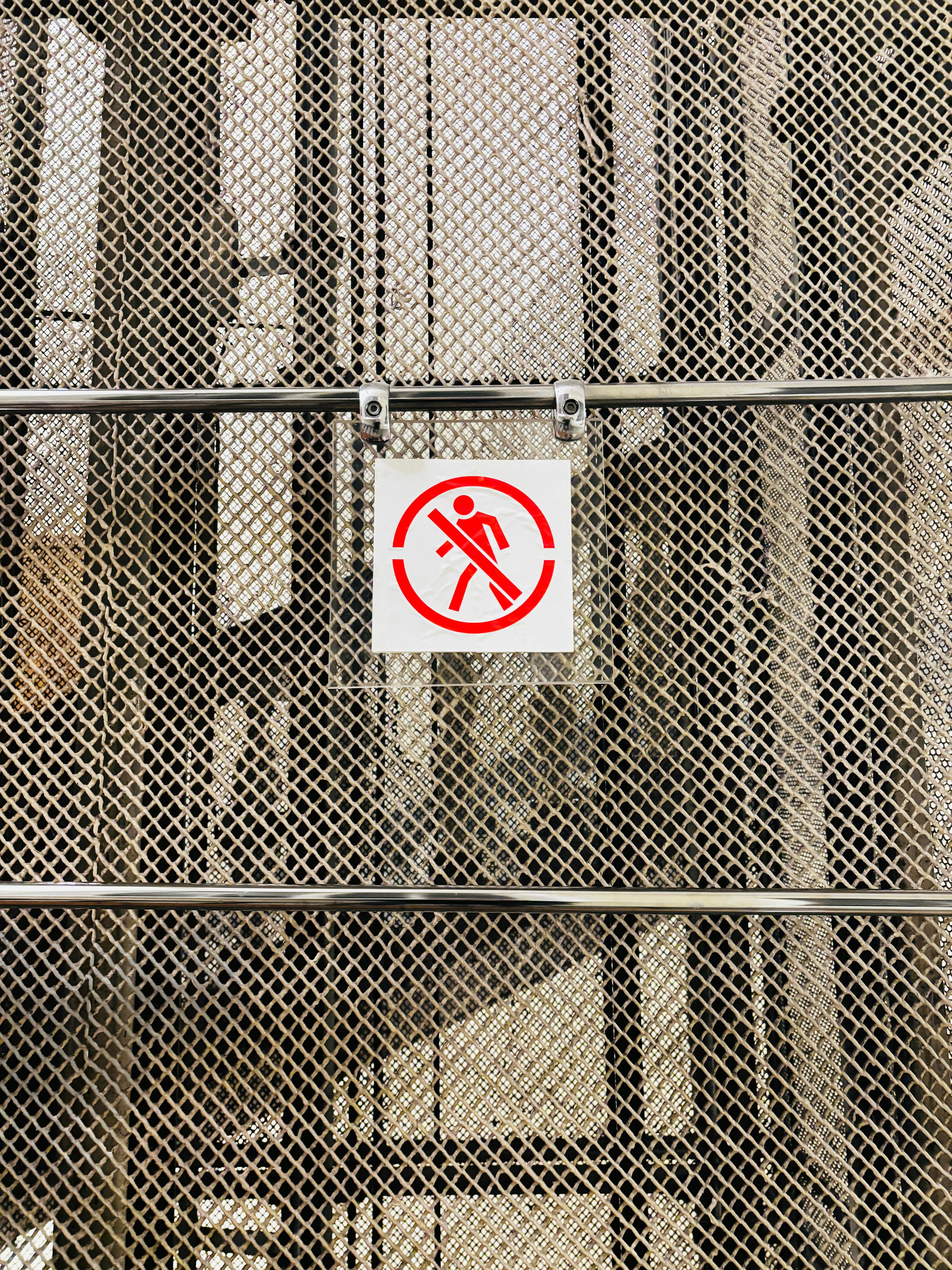 No entry sign on a metal grate