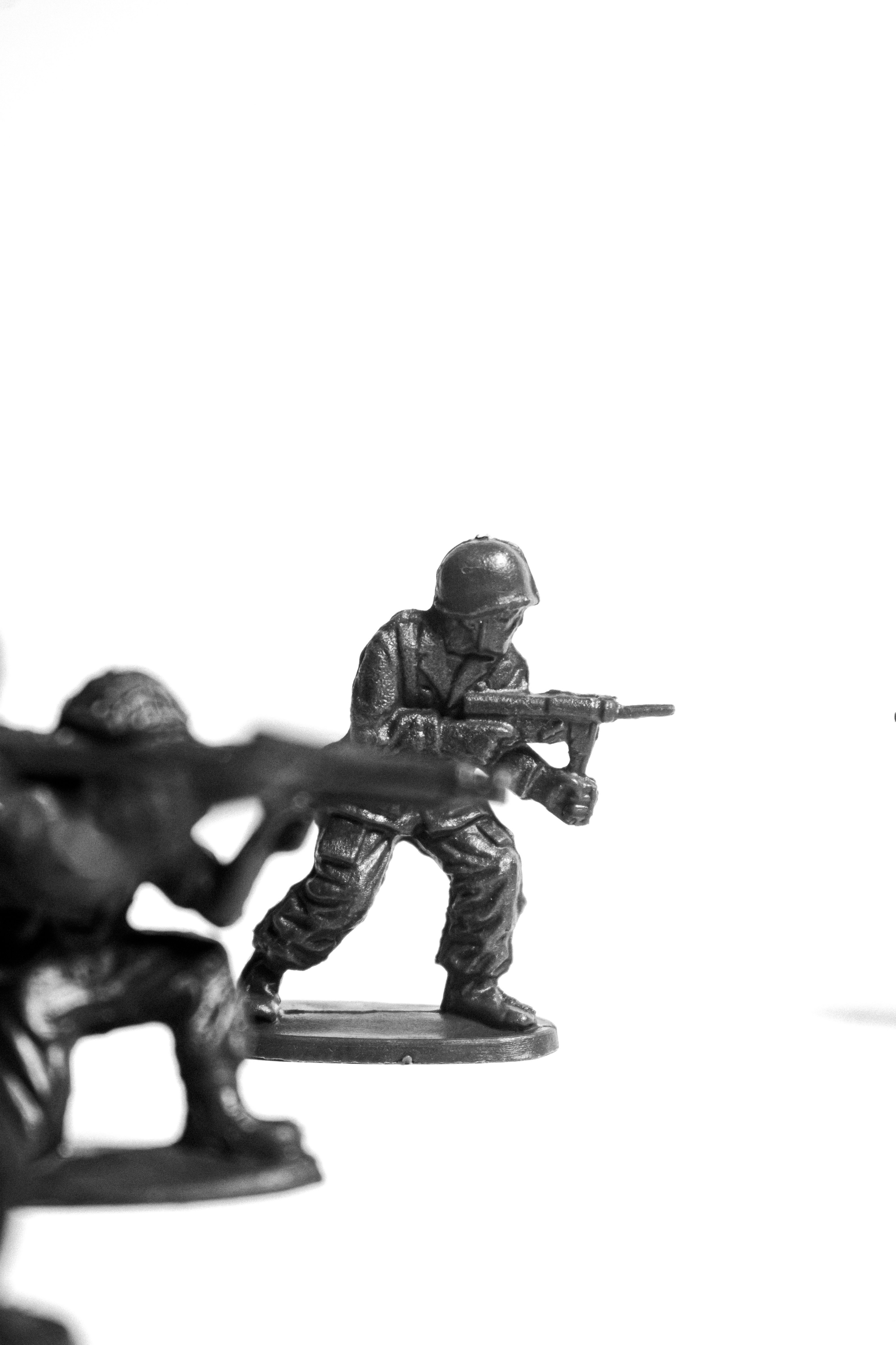 Toy soldiers in action on a white background