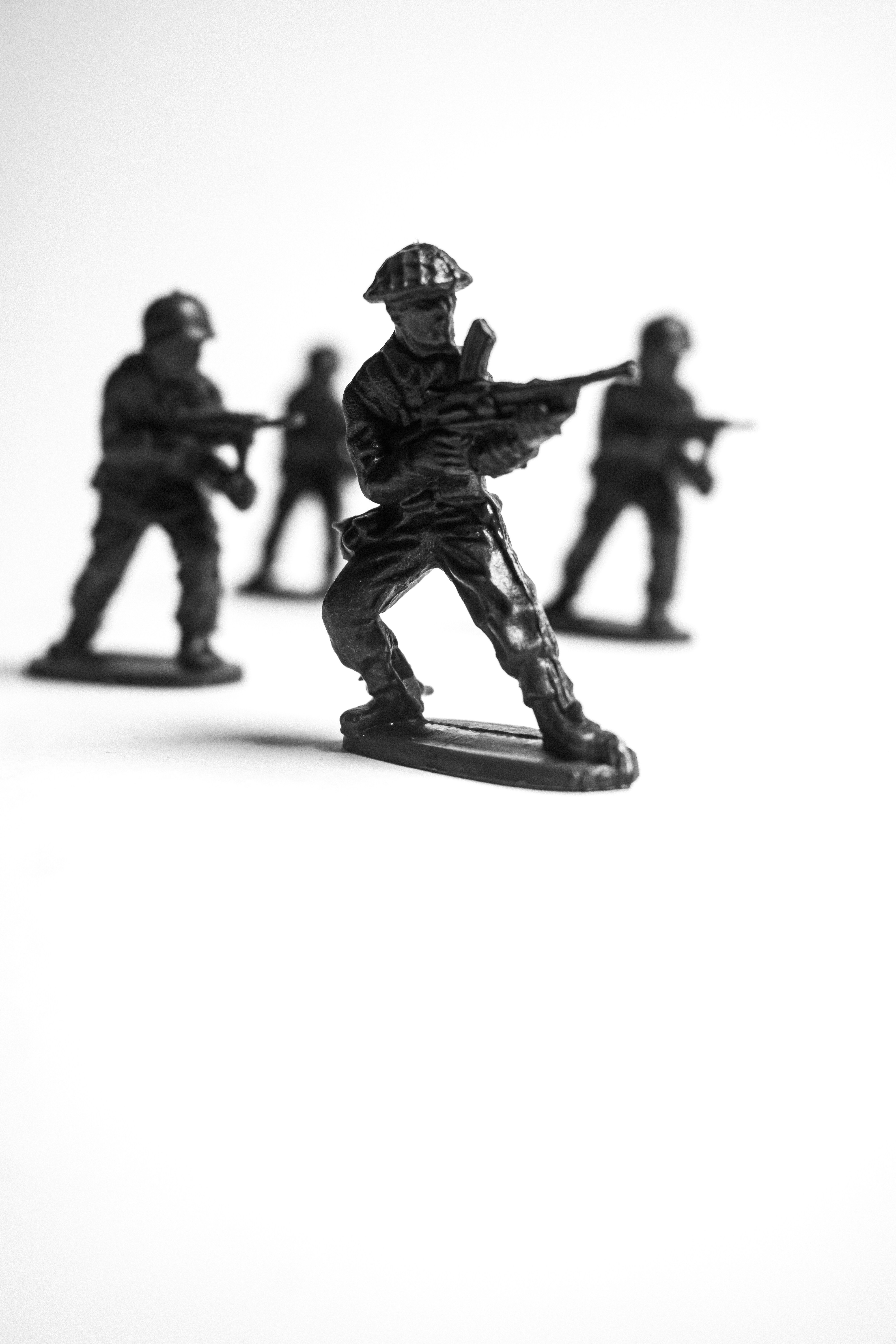 Toy soldiers in formation on a white background
