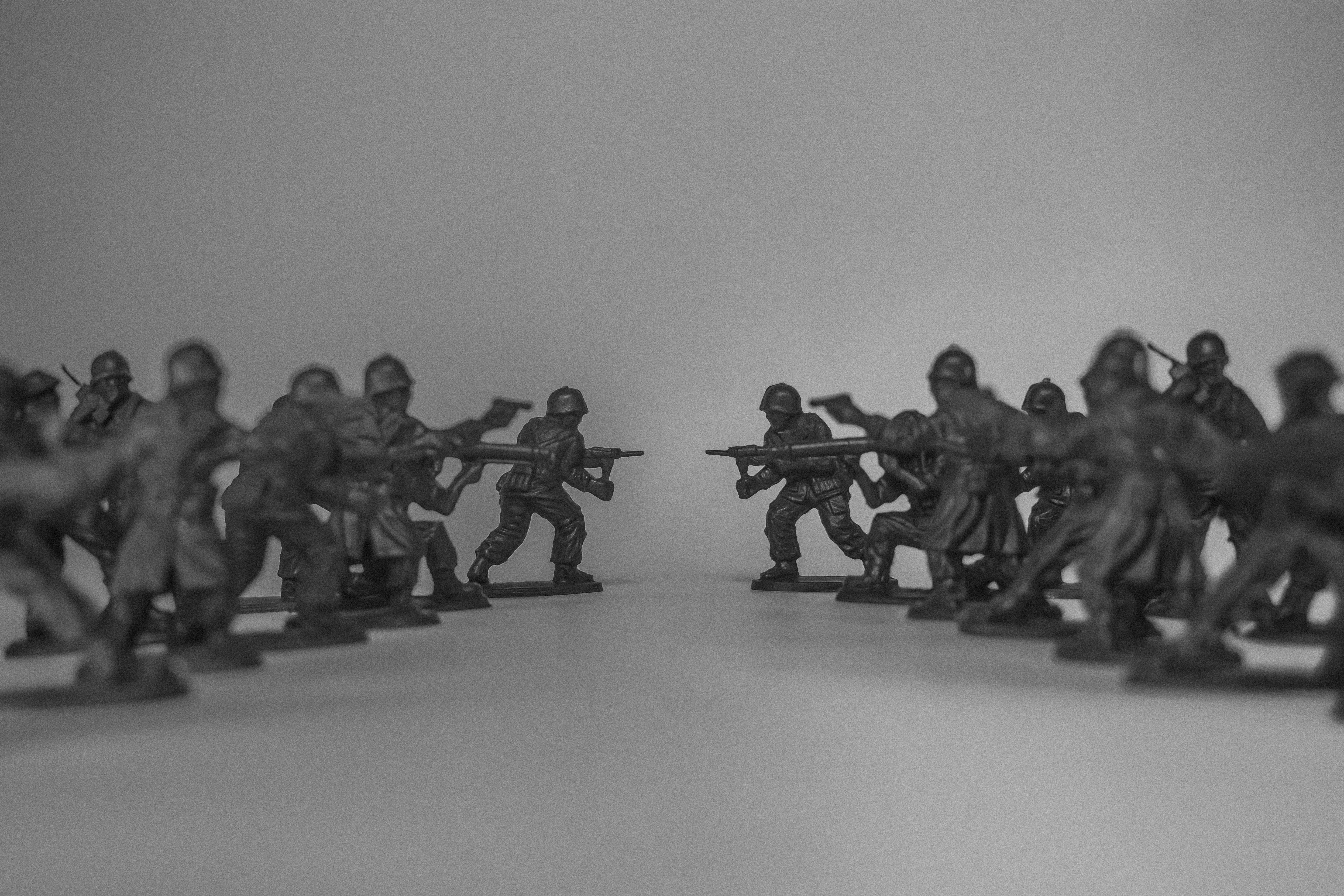 Toy soldiers facing each other in battle formation