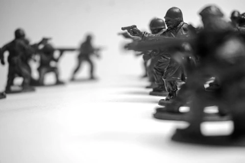 Toy soldiers in formation on a white background