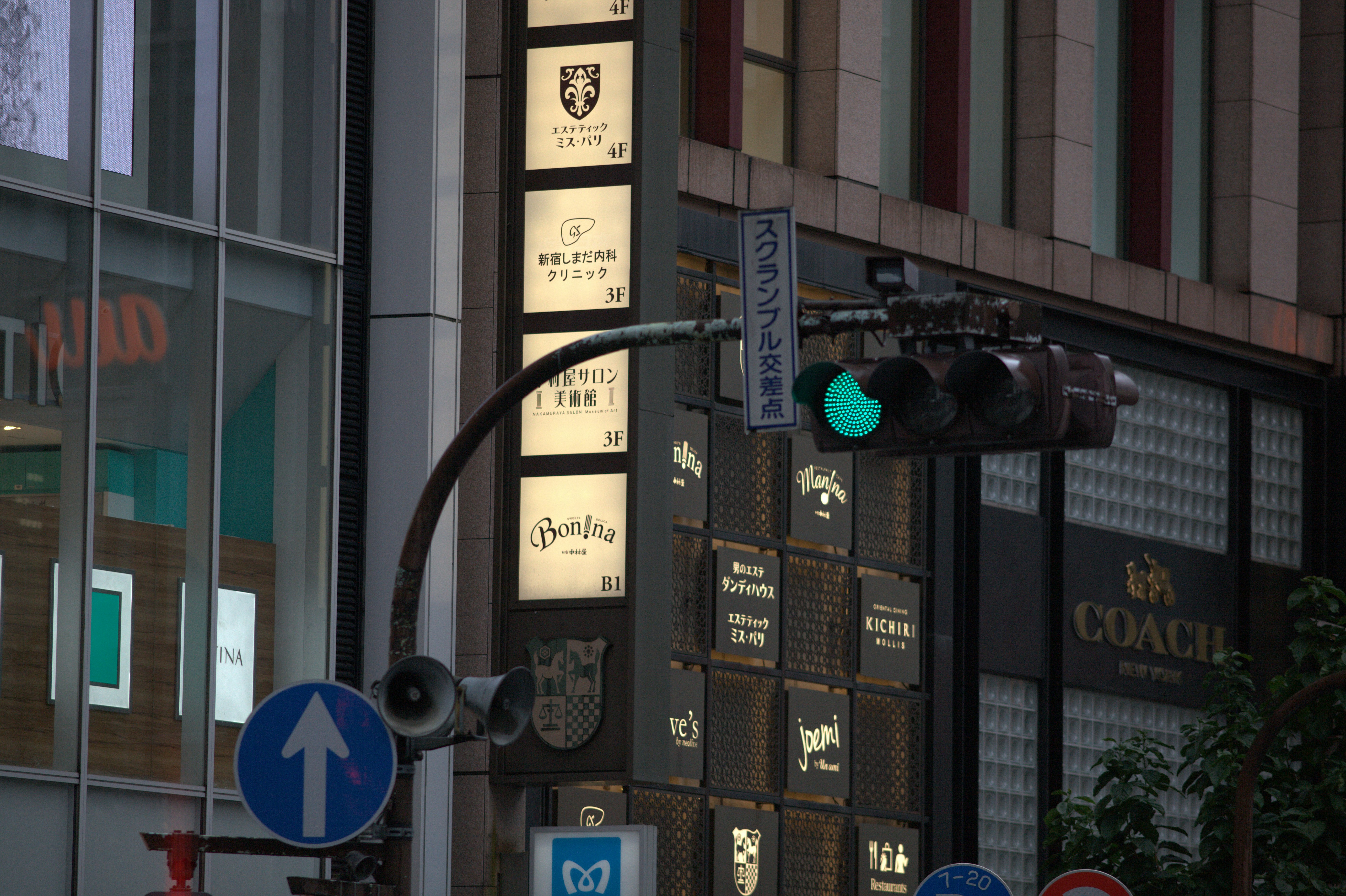Green traffic light illuminated on a city street corner