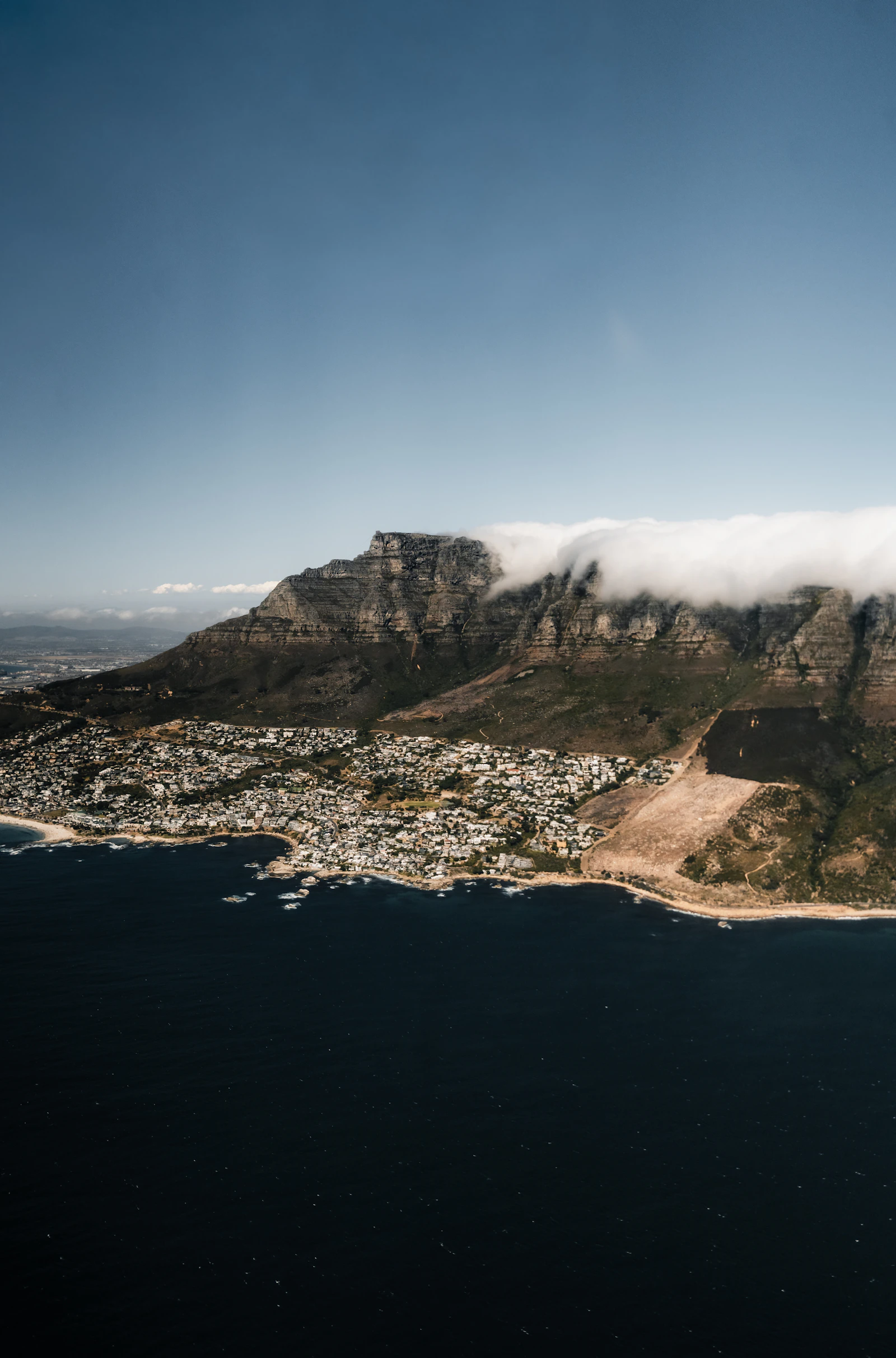 Aerial view over Table Mountain and the Cape Town coastline, as seen on a helicopter flight