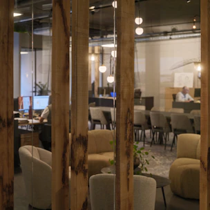 Modern office space with seating areas and workstations.