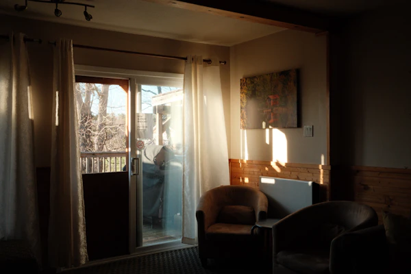 Sunlight streaming through restored sliding glass doors