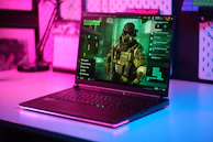 Gaming laptop displaying a first-person shooter game.