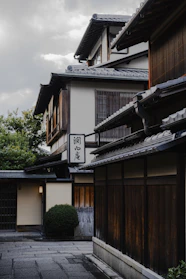 Traditional japanese buildings with wooden facades and tiled roofs.