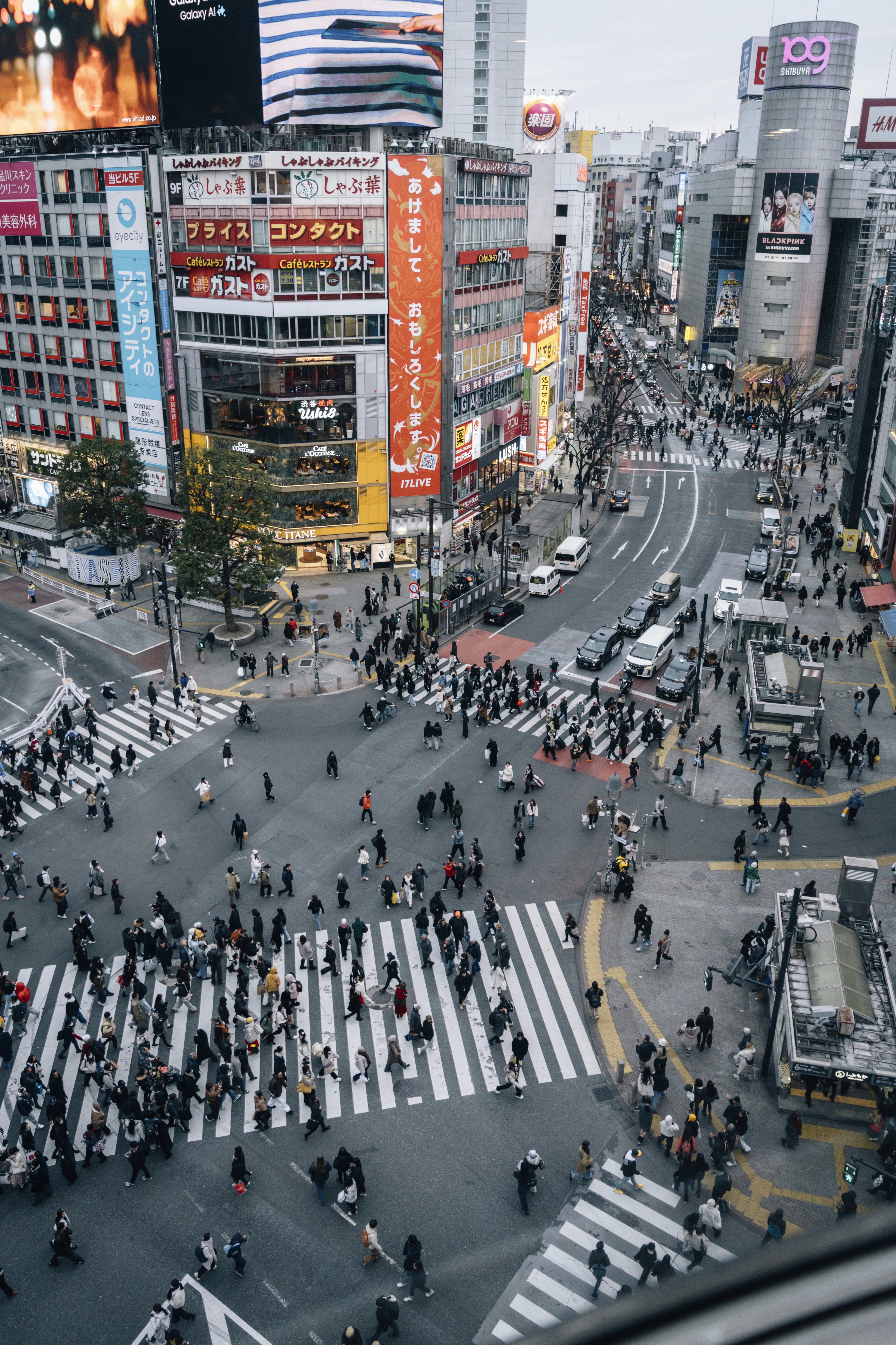 Bustling shibuya crossing in tokyo with many pedestrians