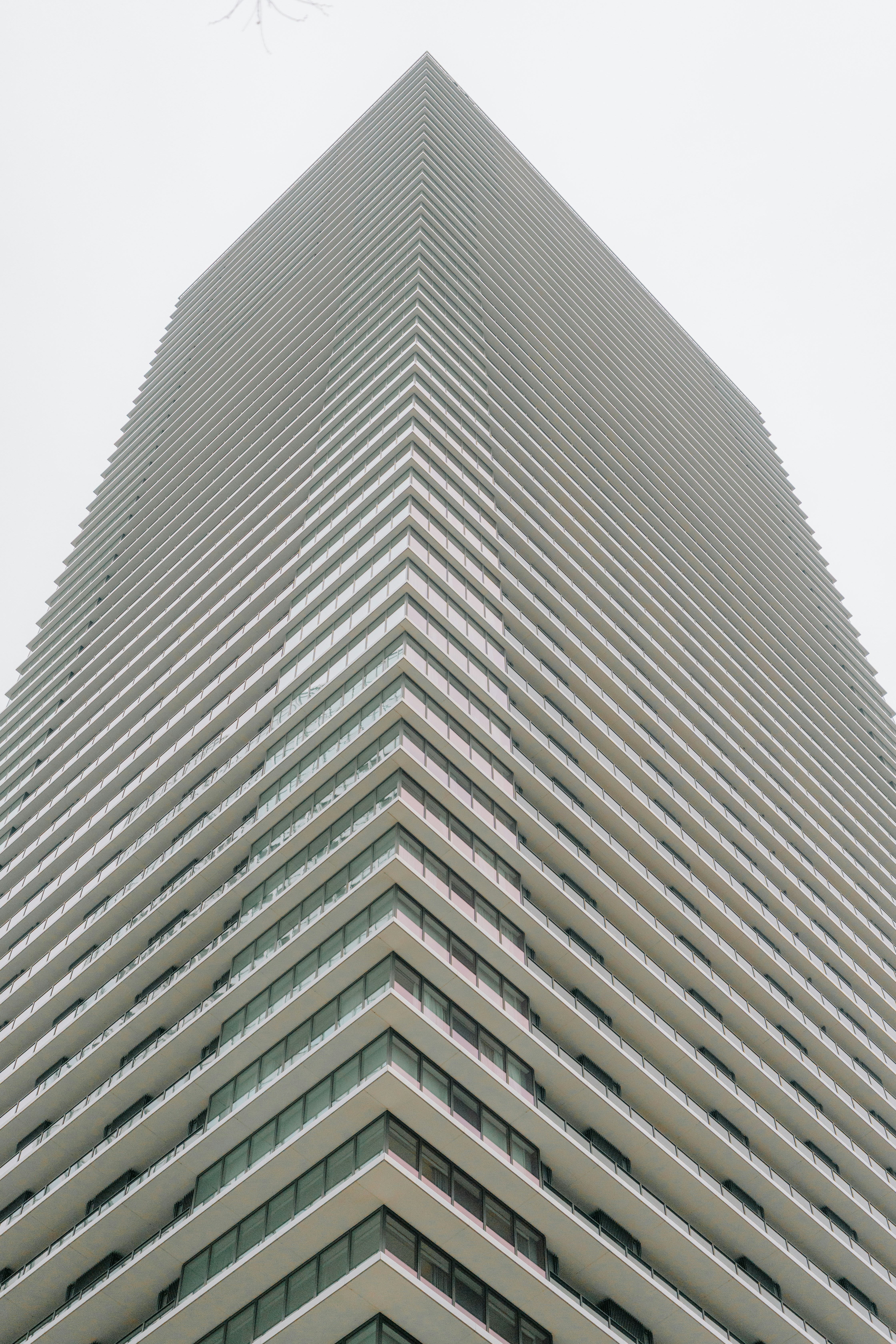 Modern skyscraper with repeating horizontal lines and balconies