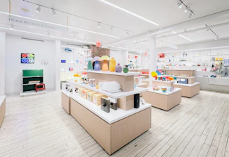Modern retail store interior with display shelves and products.