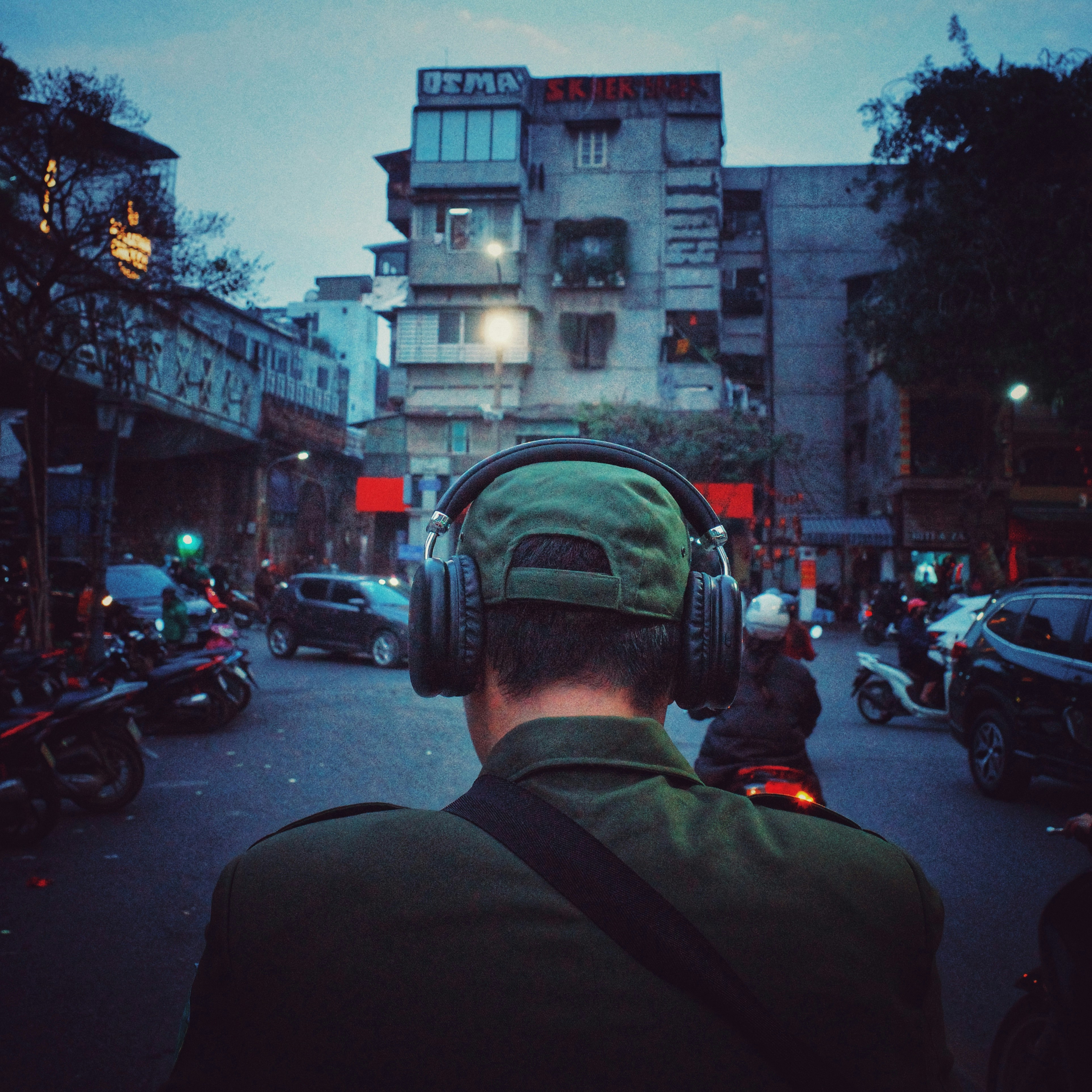 Man wearing headphones on a city street