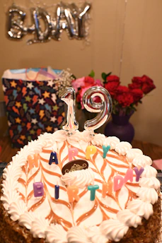 Birthday cake with "19" candles and decorations