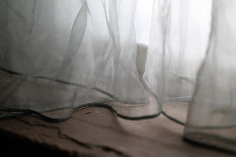 Warm morning light through sheer curtains - Simple Grace bodywork space