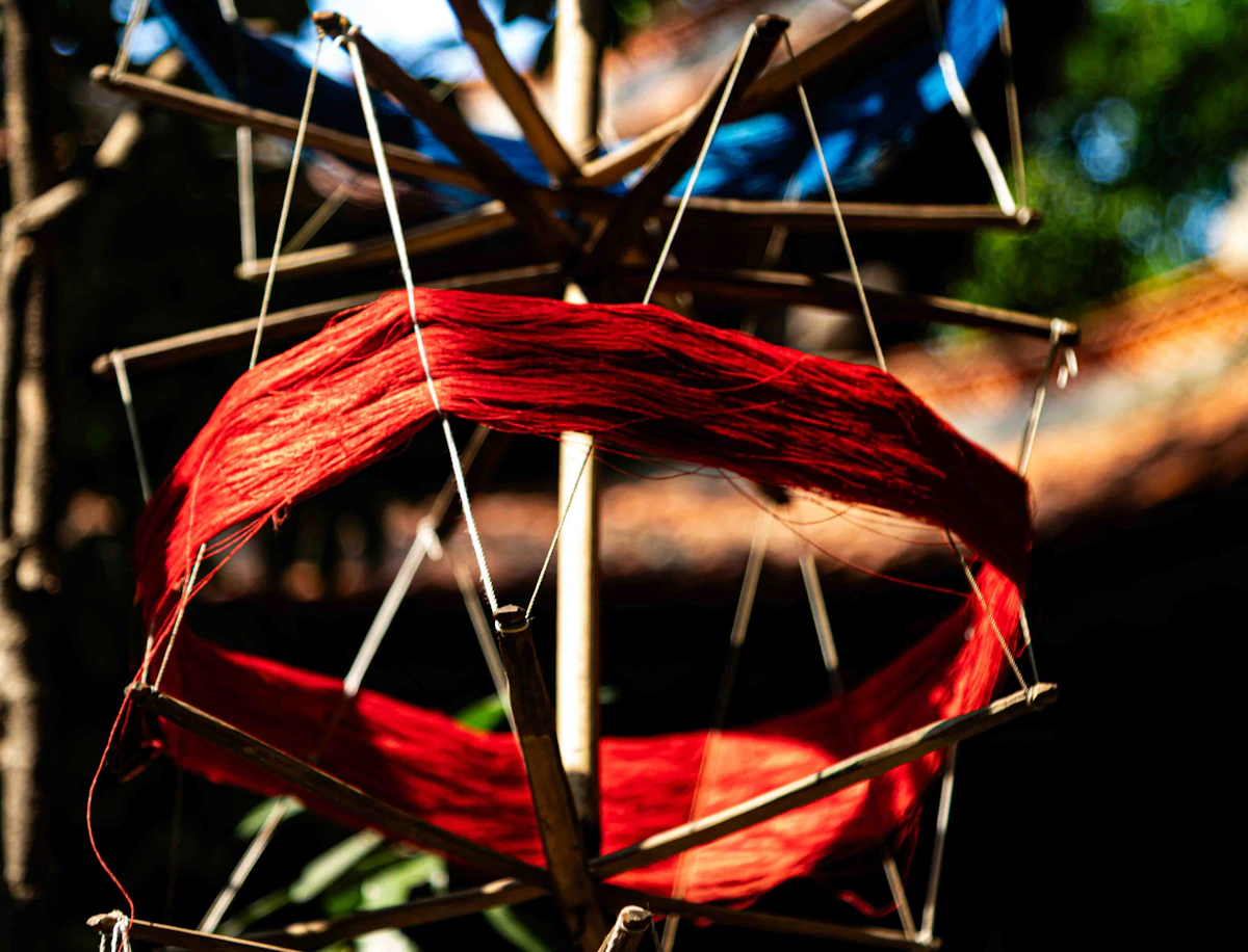 Warm-toned Tassar yarn on spindle