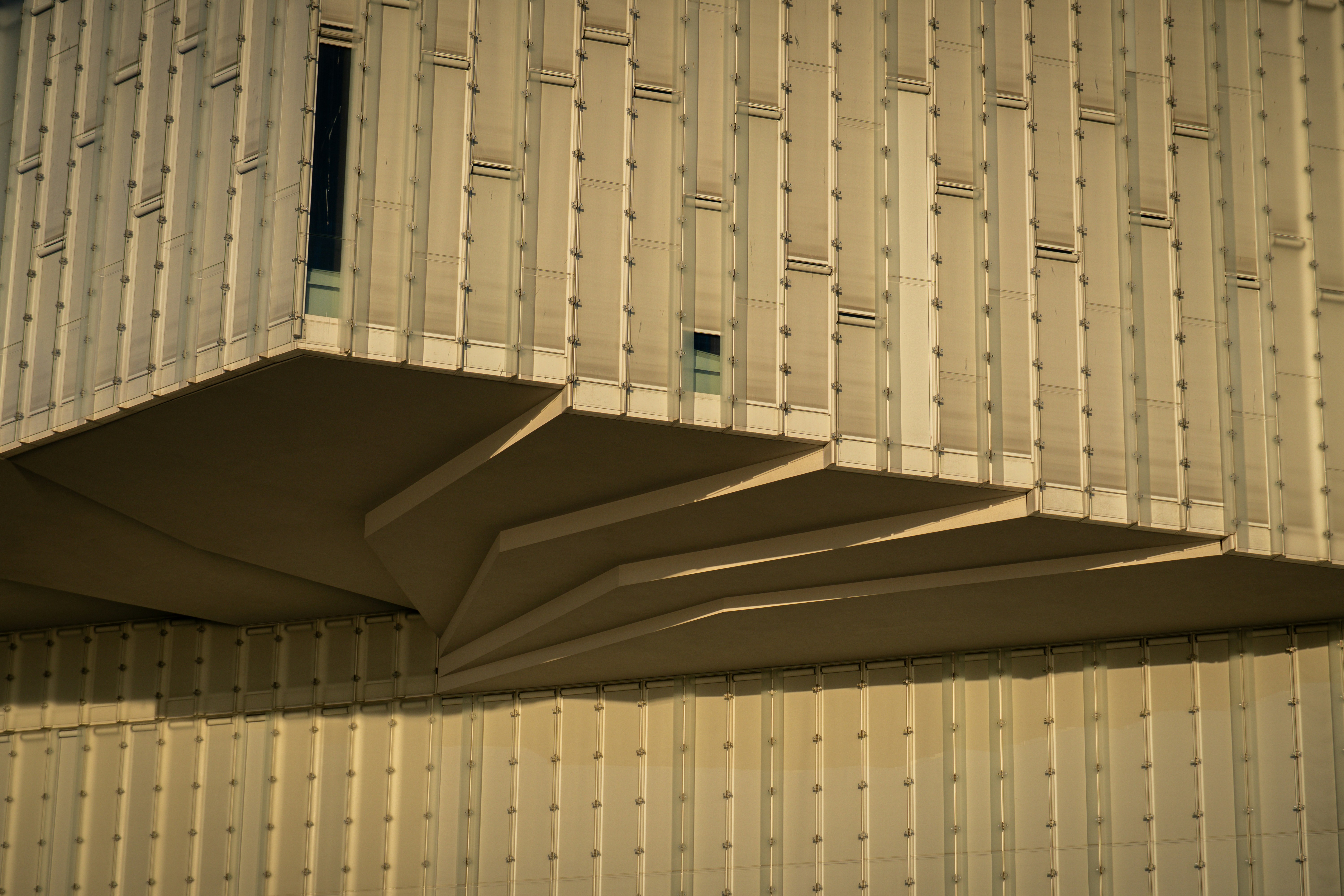 Modern concrete building facade with geometric pattern