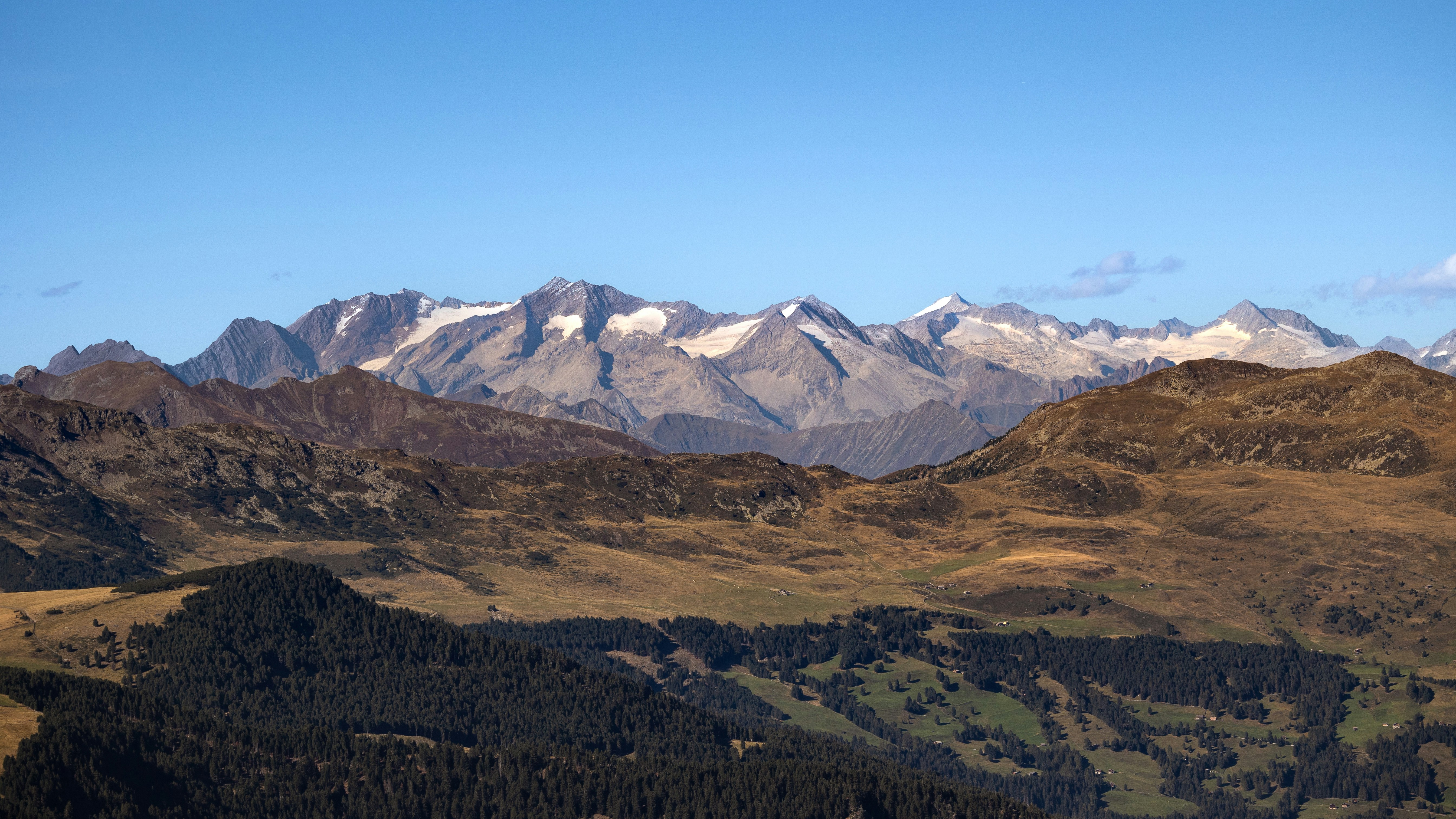 Majestic mountain range under a clear blue sky