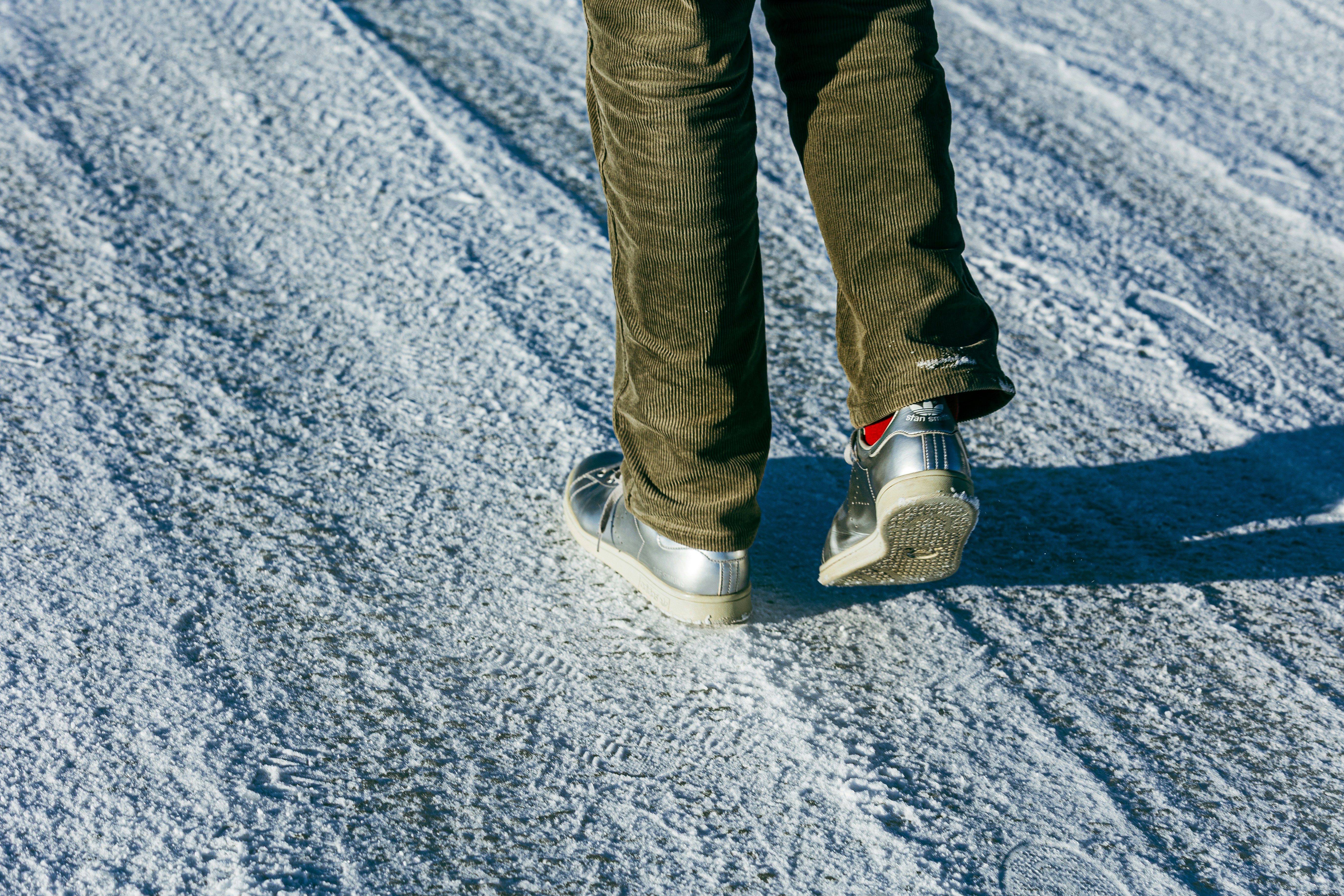 Person walking on a textured, icy surface