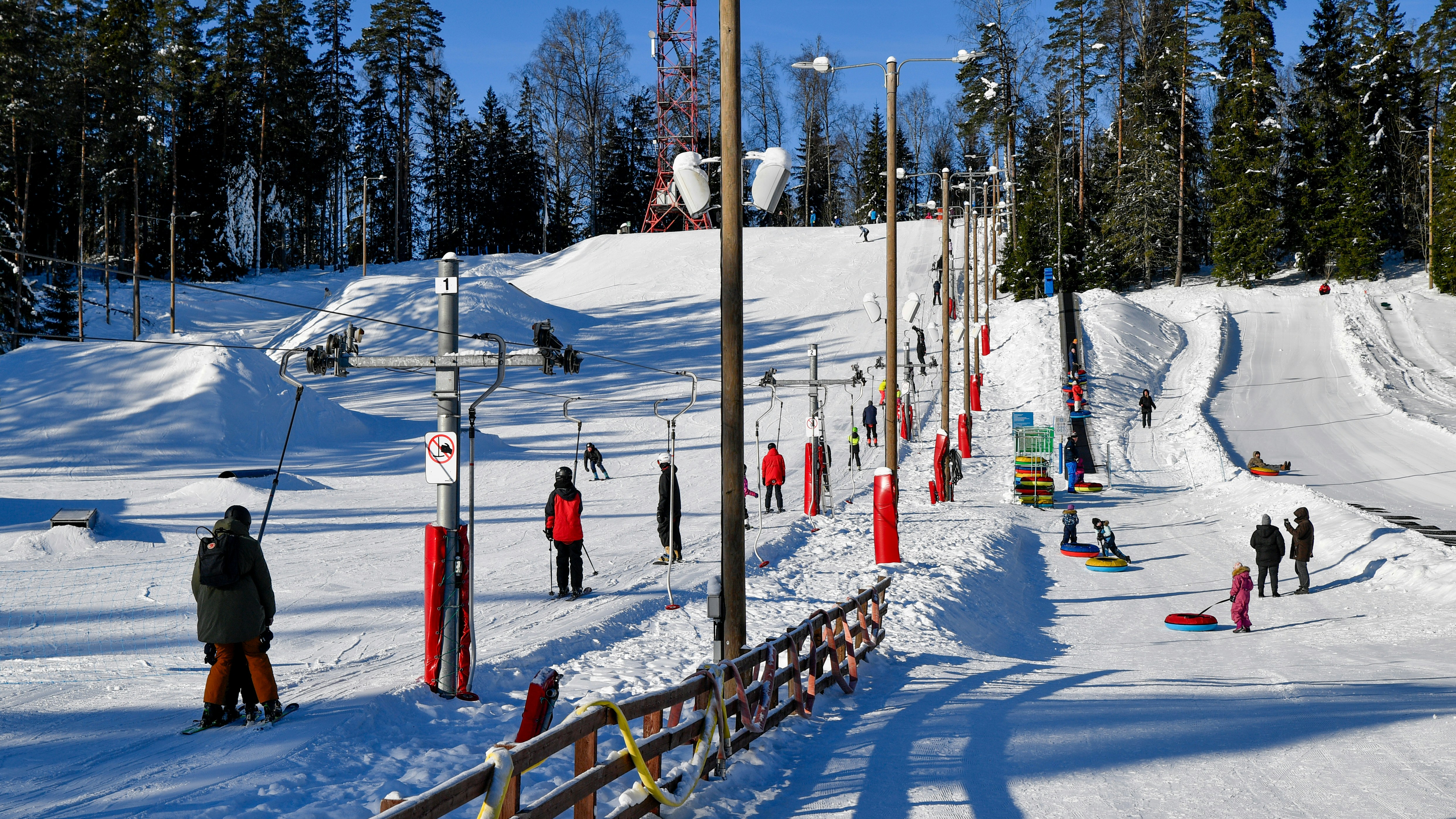 Ski resort with snow-covered slopes and trees