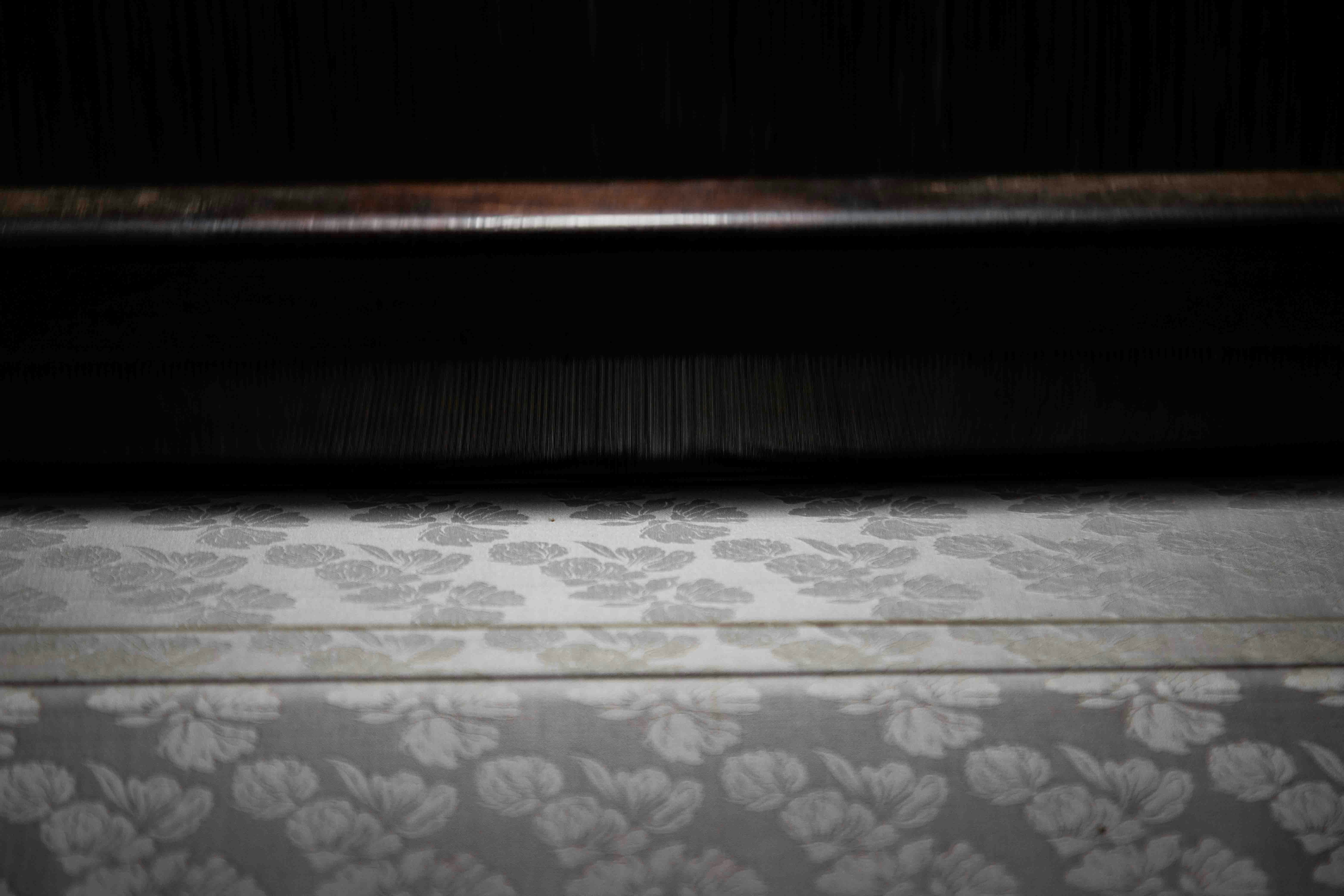 Close-up of a loom with patterned fabric