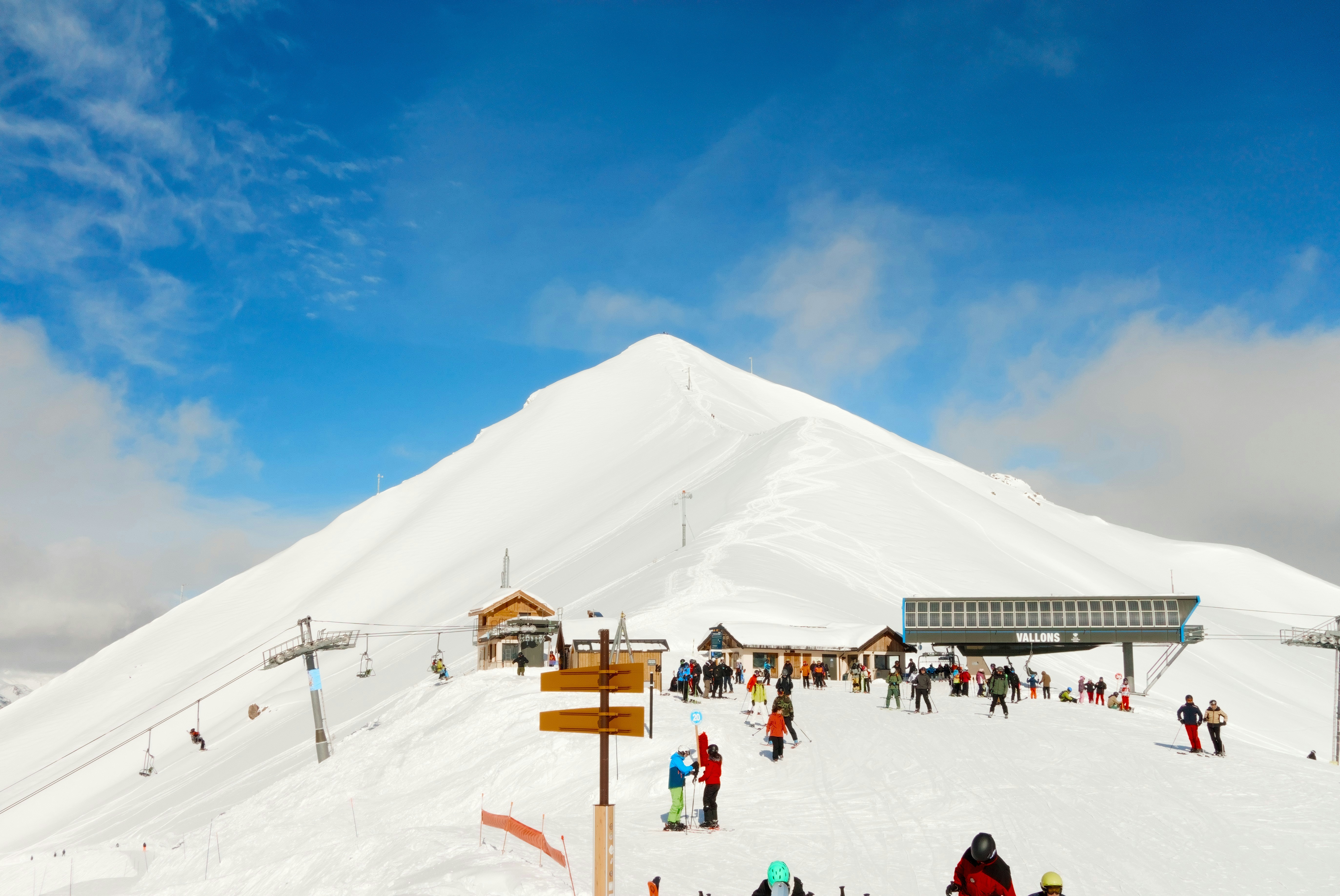 Ski resort with snowy mountain and clear blue sky