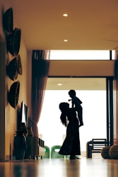 Happy parent with child at home