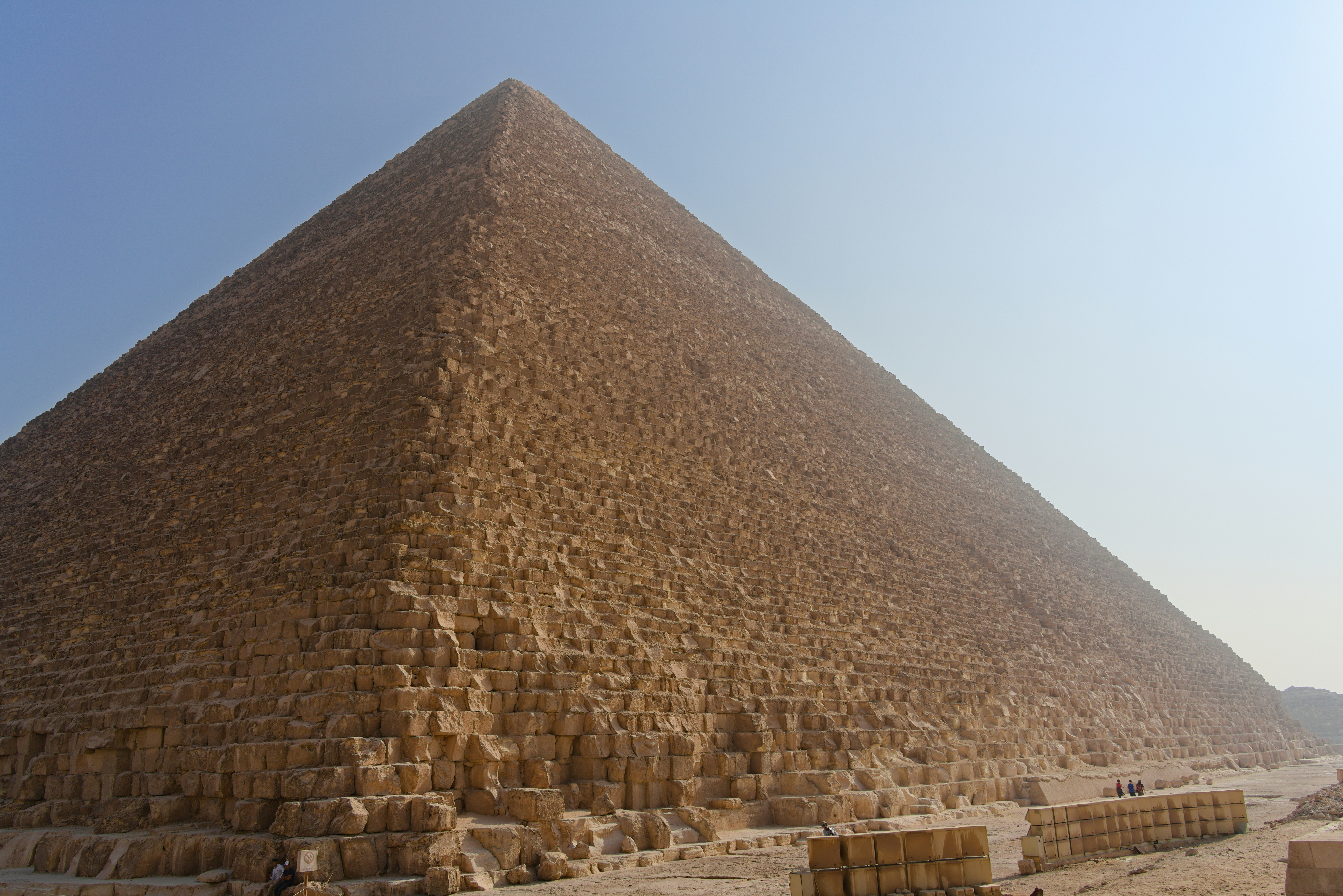 The great pyramid of giza under a clear blue sky.