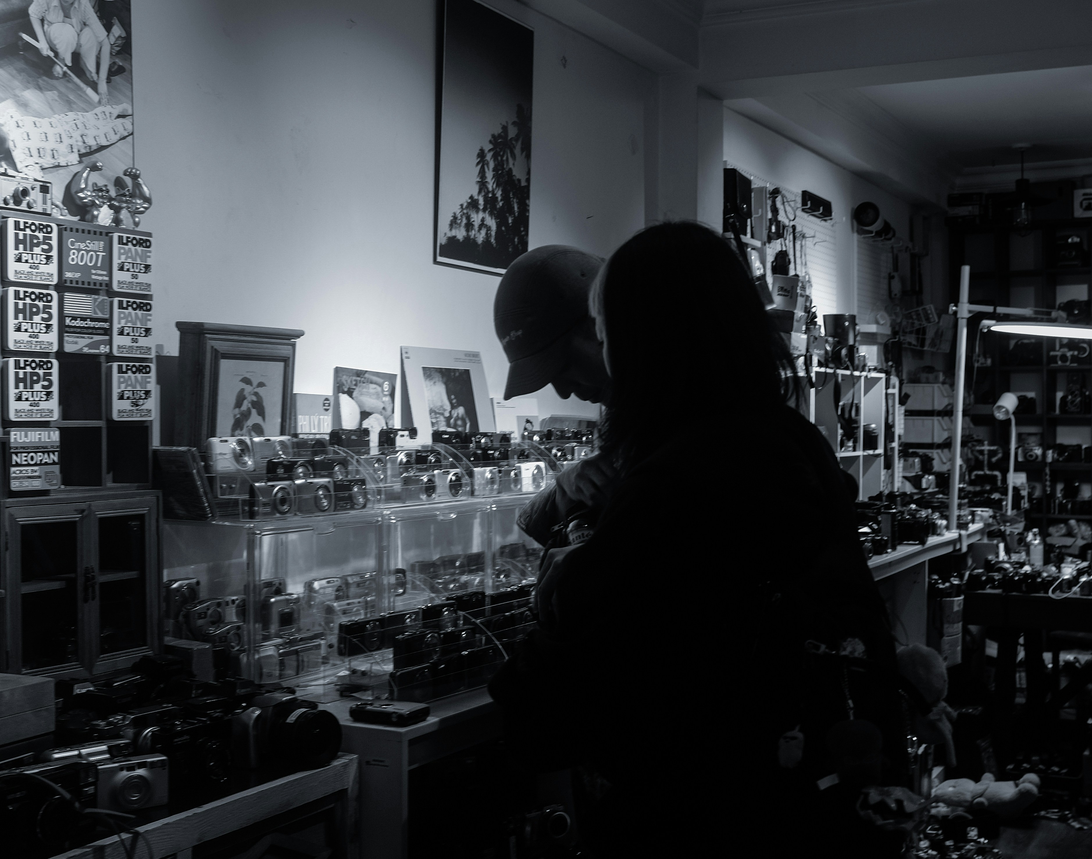 Two people browsing a cluttered shop filled shop