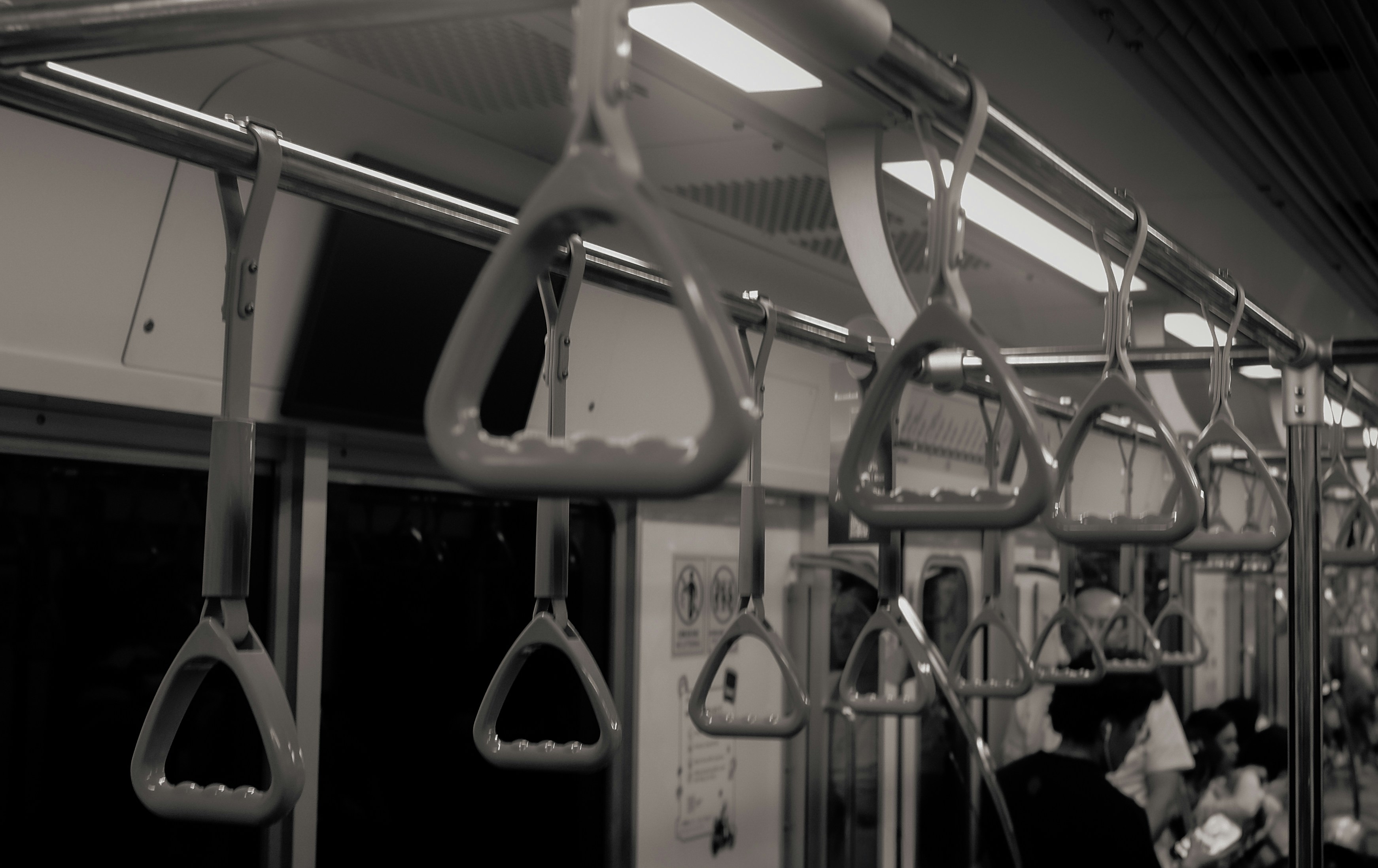 Hanging handles inside a public transport vehicle.