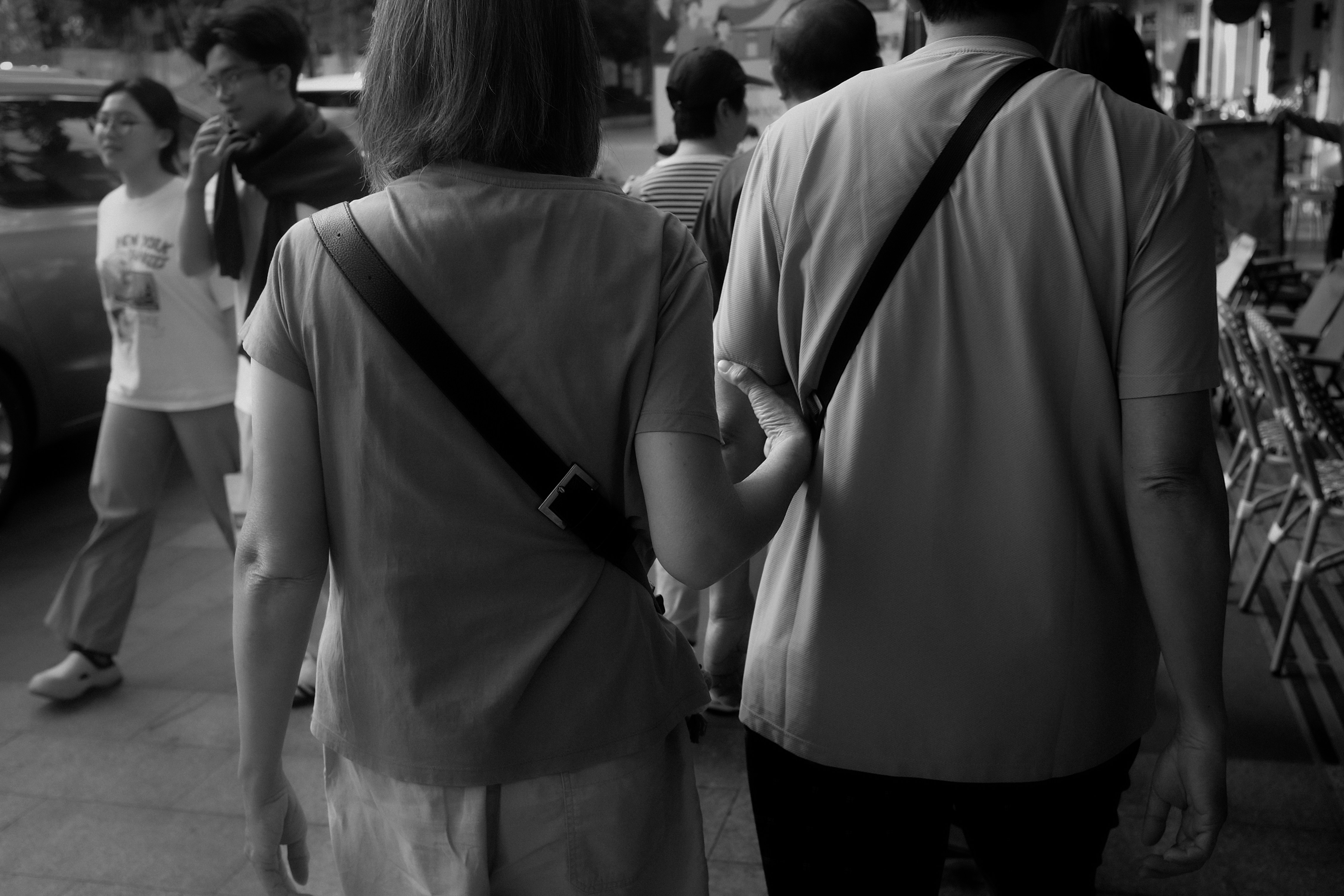 Two people walking together outdoors