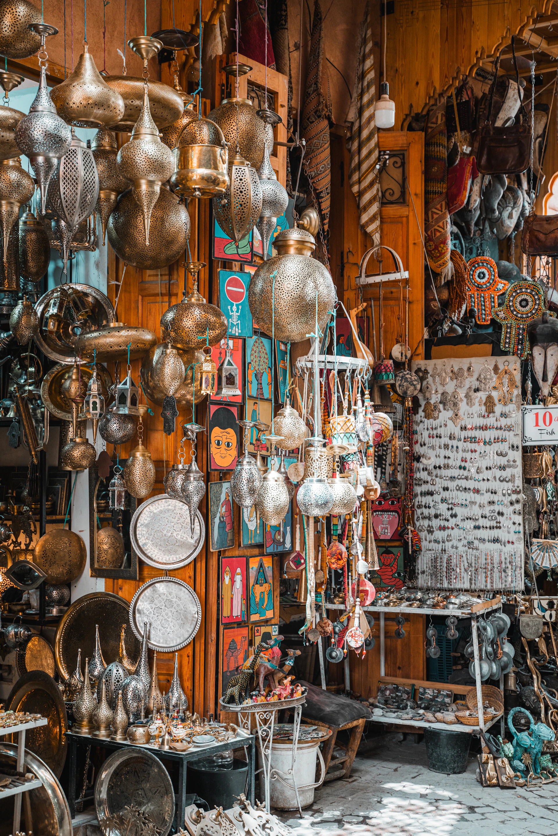 Ornate brass lanterns and decorative items displayed in a shop.
