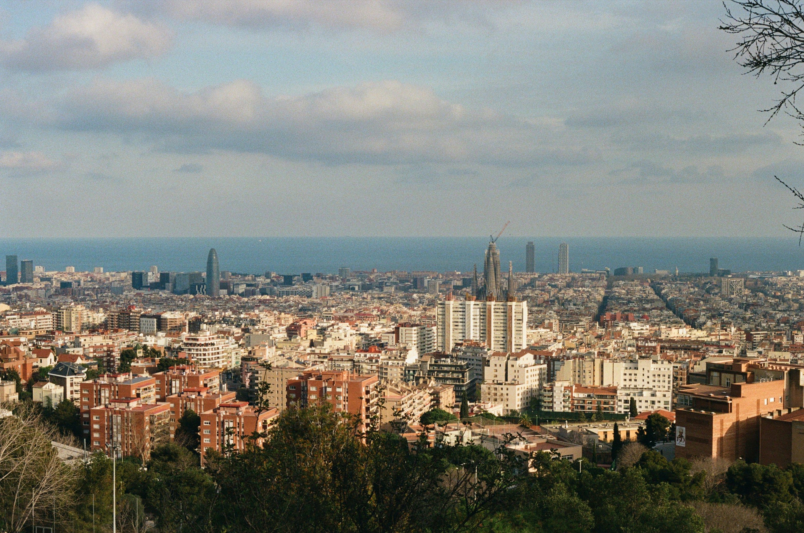 Panoramic cityscape of Barcelona with the sea in the background