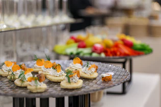 Appetizers with carrots and dill on a platter.