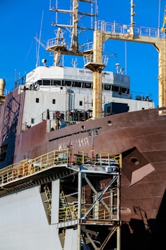 Large cargo ship with detailed superstructure and industrial structure.