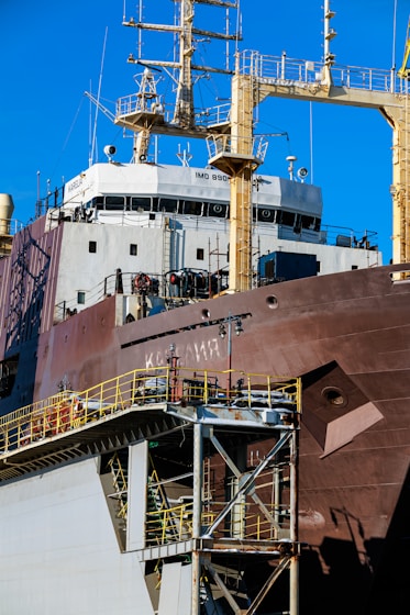 Large cargo ship with detailed superstructure and industrial structure.