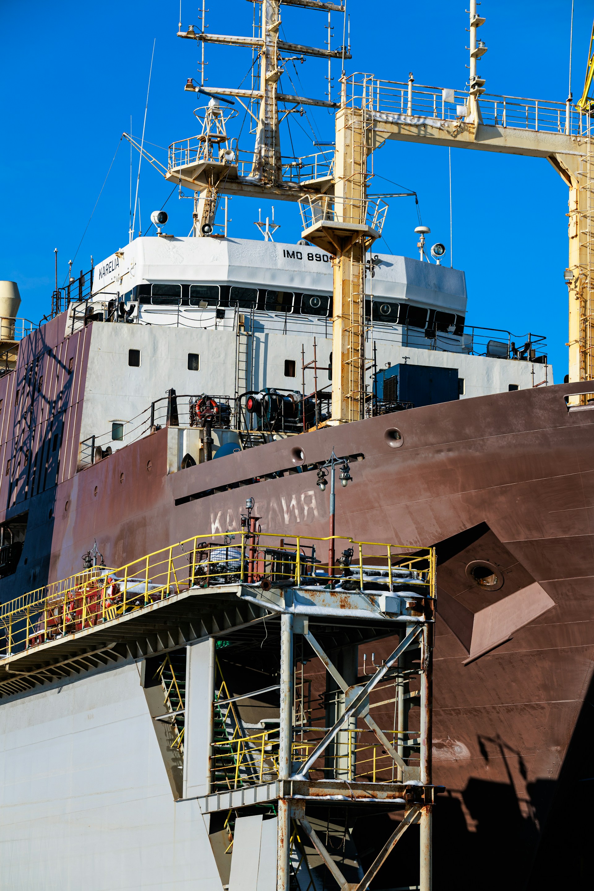 Large cargo ship with detailed superstructure and industrial structure.