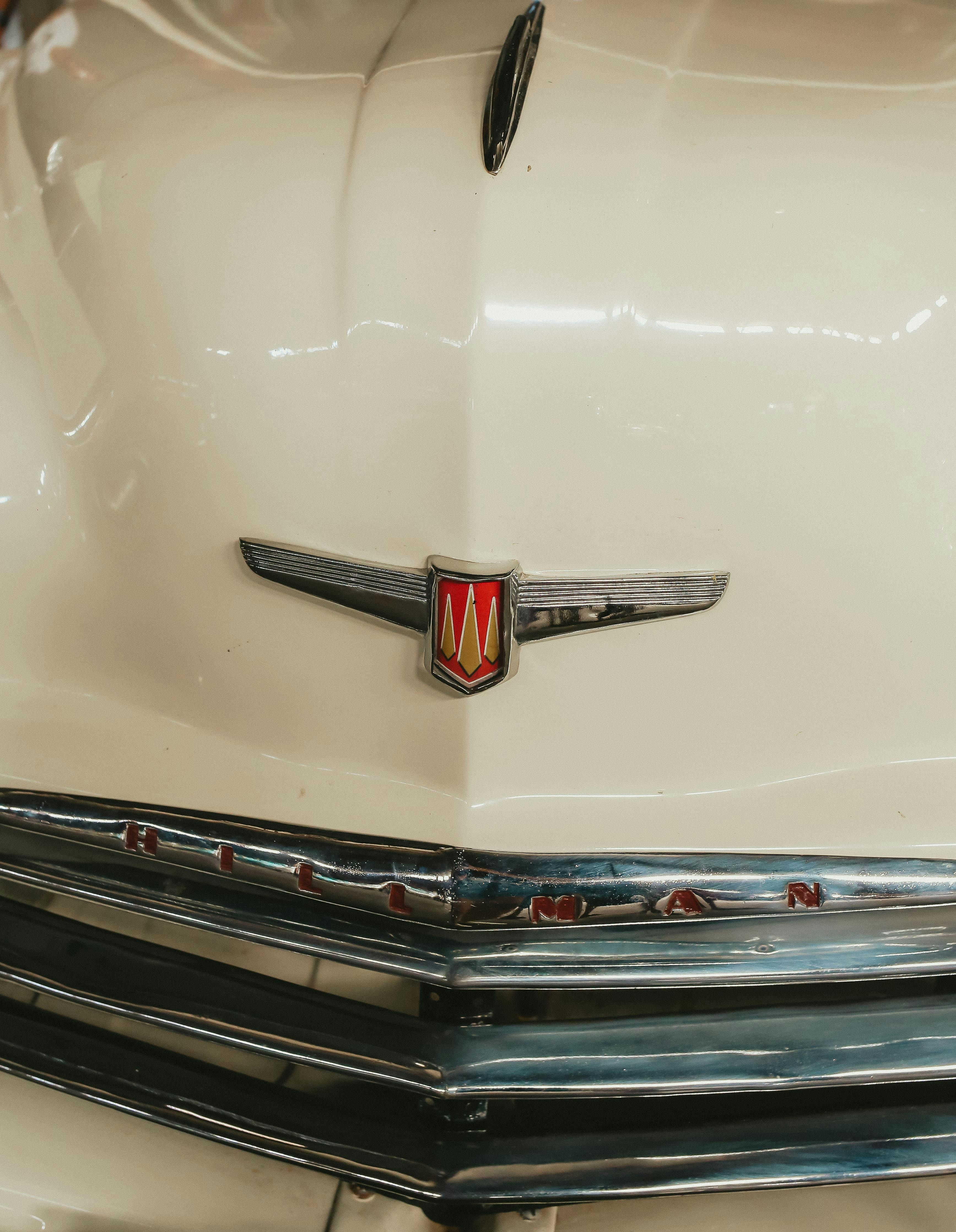 Close-up of vintage car emblem and grille