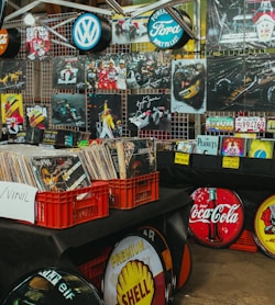Records and vintage signs displayed at a market