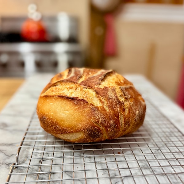 Artisan bread loaves cooling on the rack