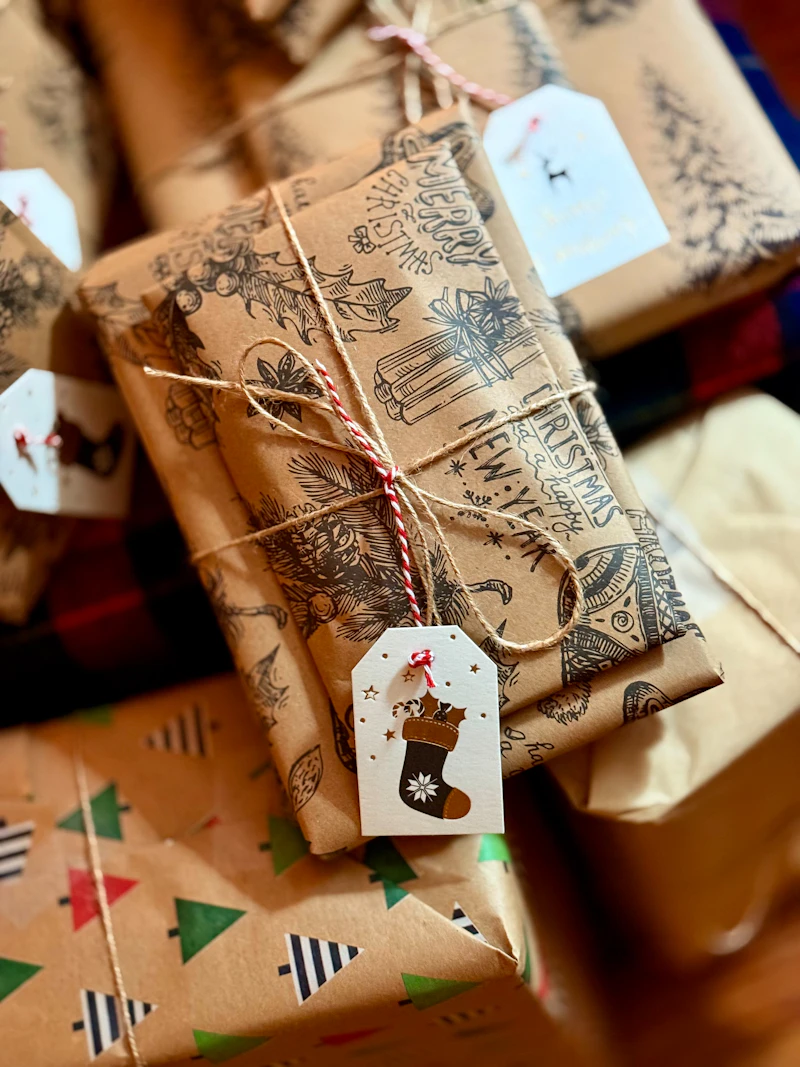 Close-up of a cookie box with crinkle fill tied with a satin ribbon bow