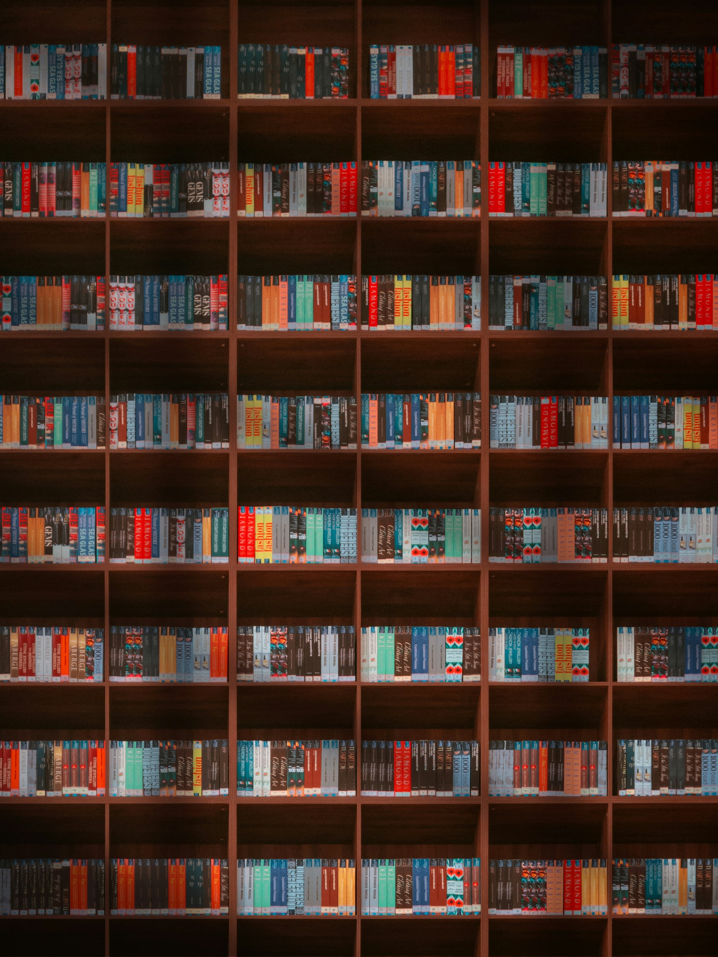 Wall of bookshelves filled with colorful books