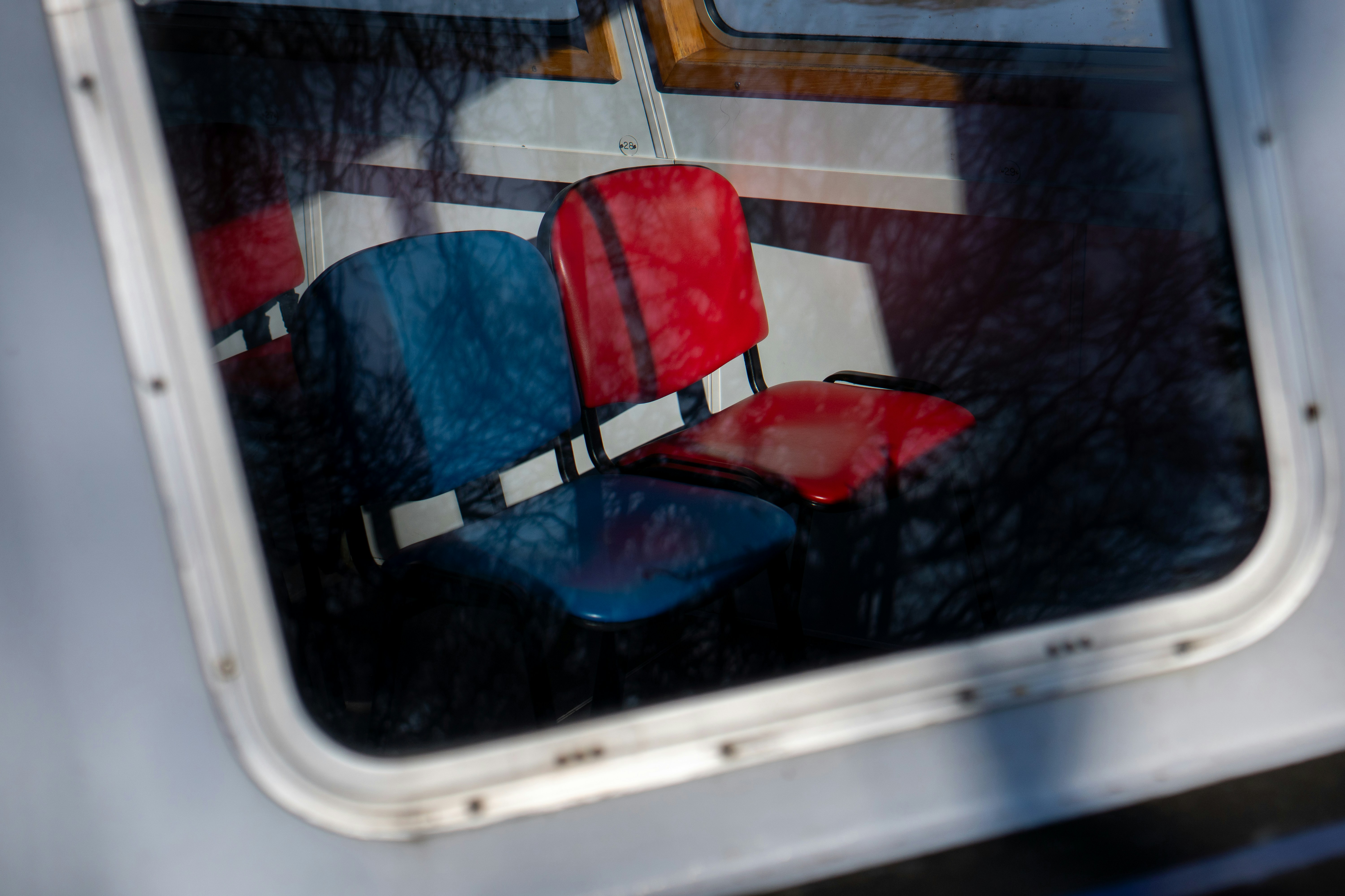 Two life vests on a boat seat