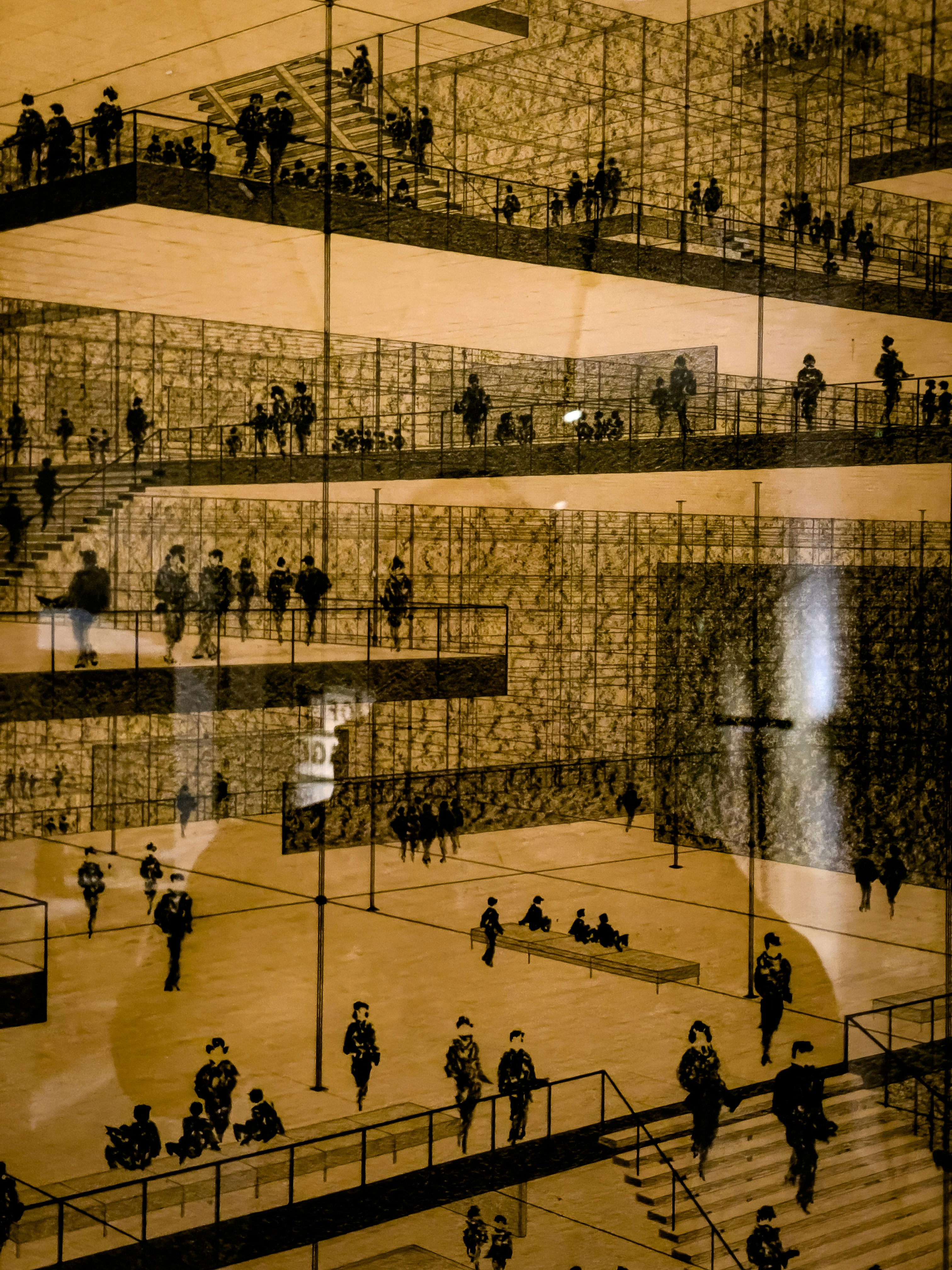 Personas en varios niveles de un edificio moderno