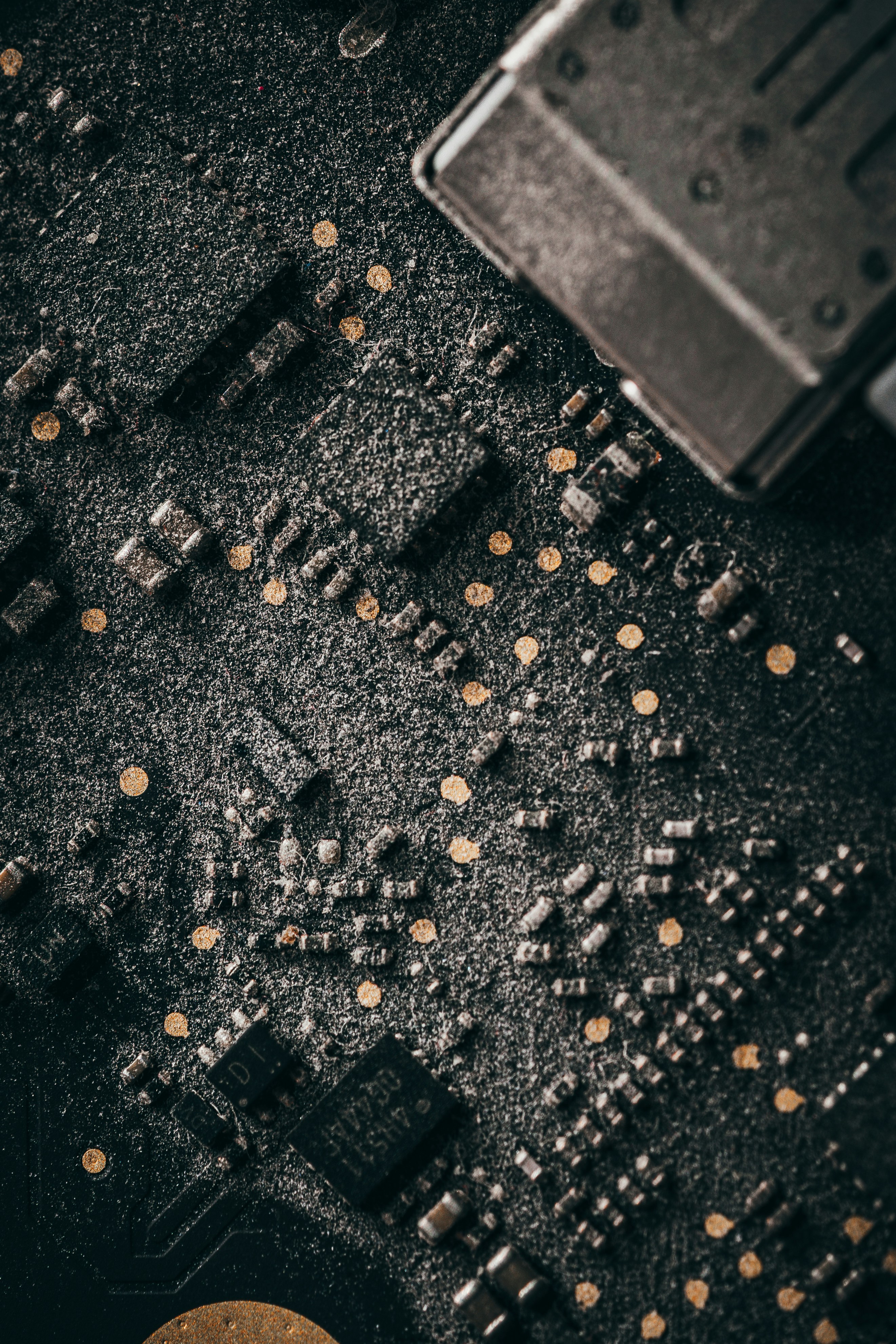 Close-up of a dirty electronic circuit board
