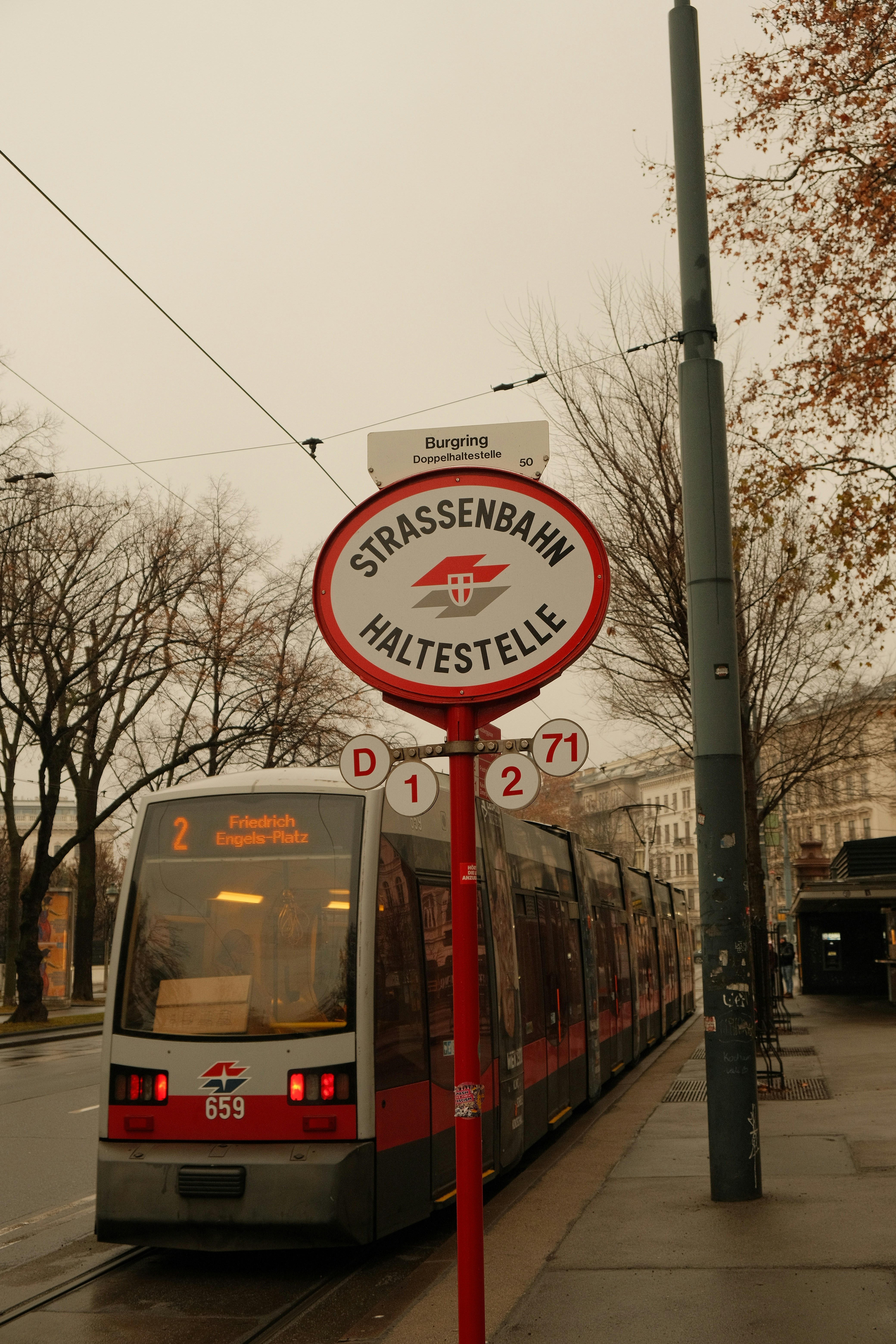 A tram at a streetcar stop in vienna