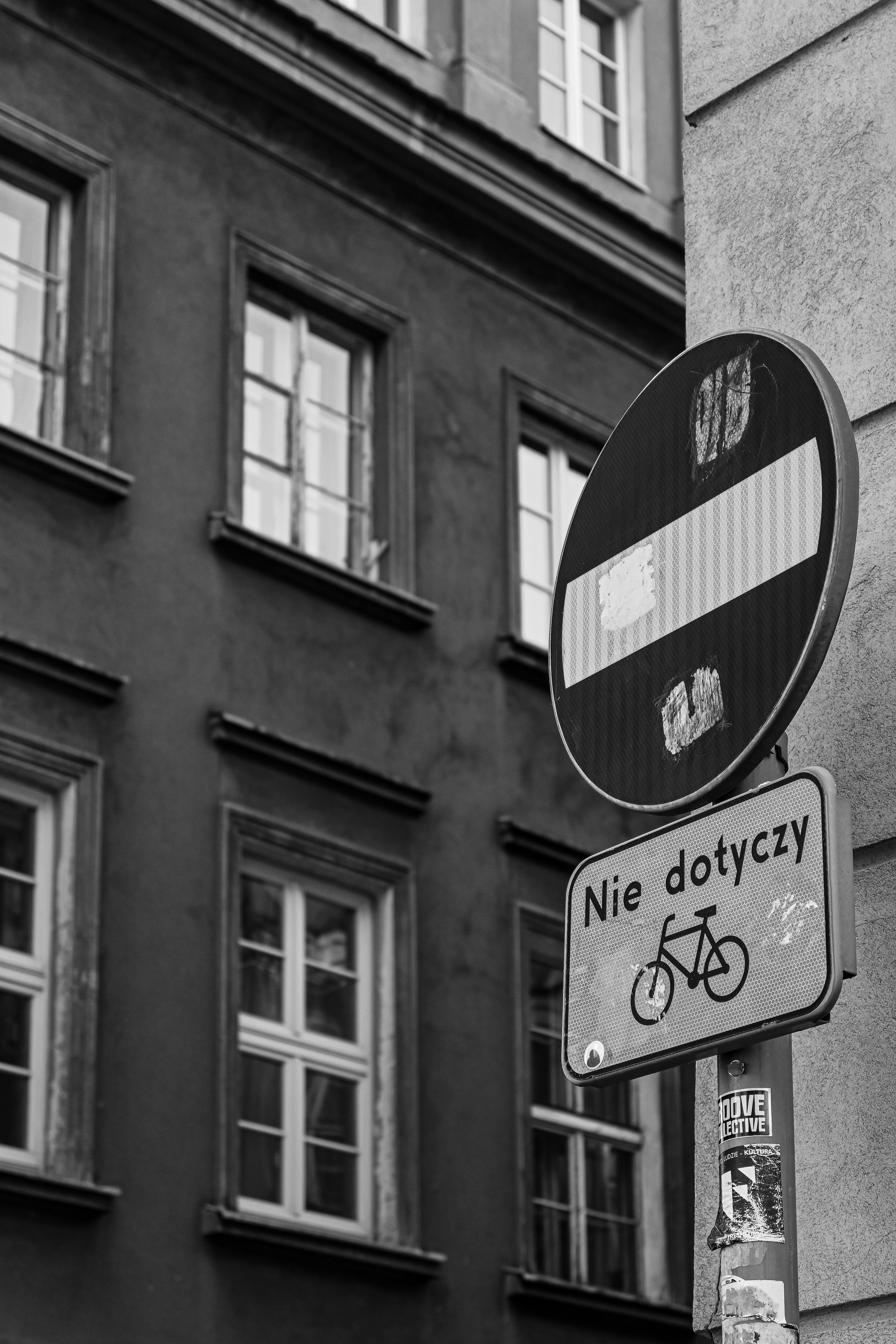 Street sign in front of an old building