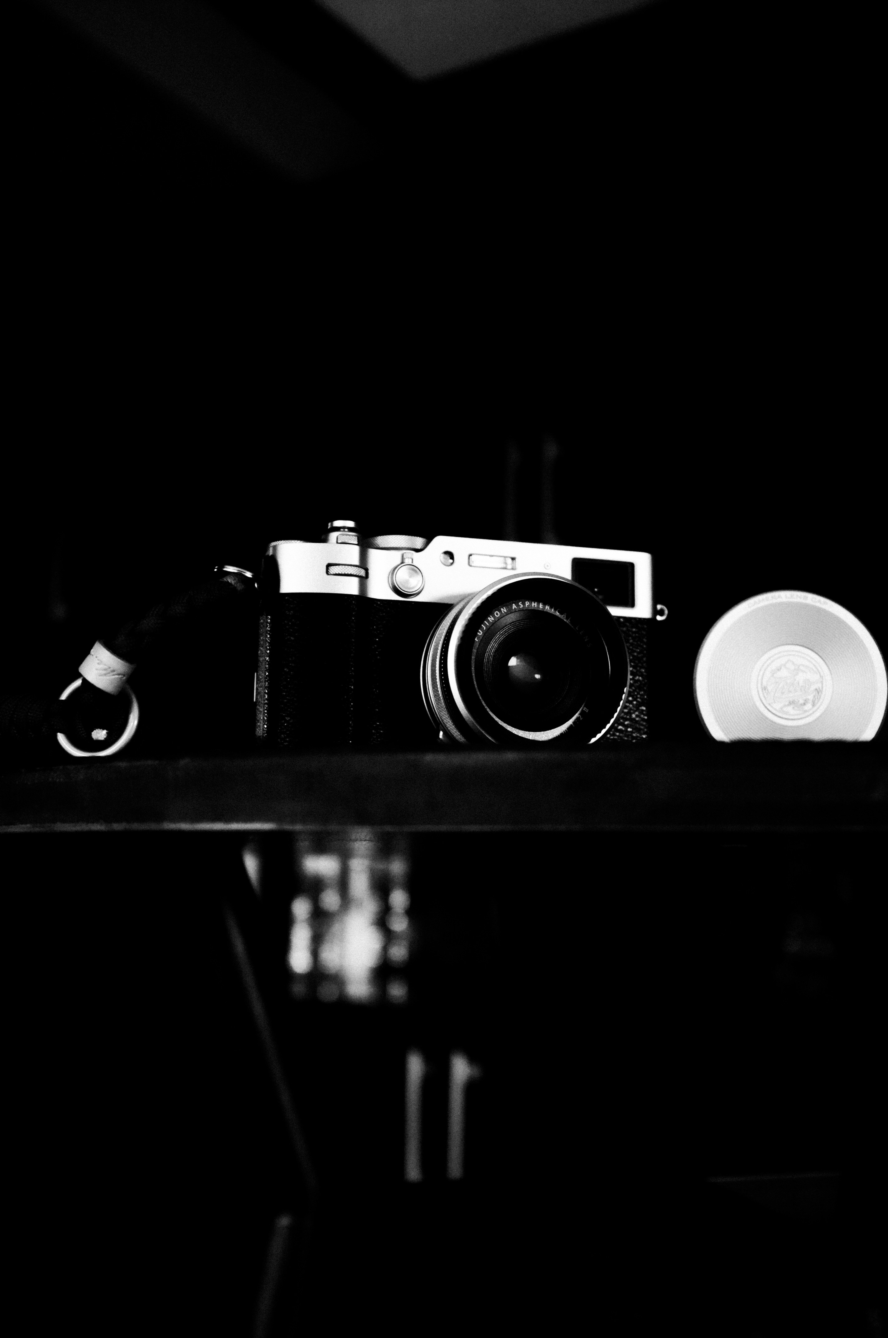 A black and white close-up of a vintage camera.