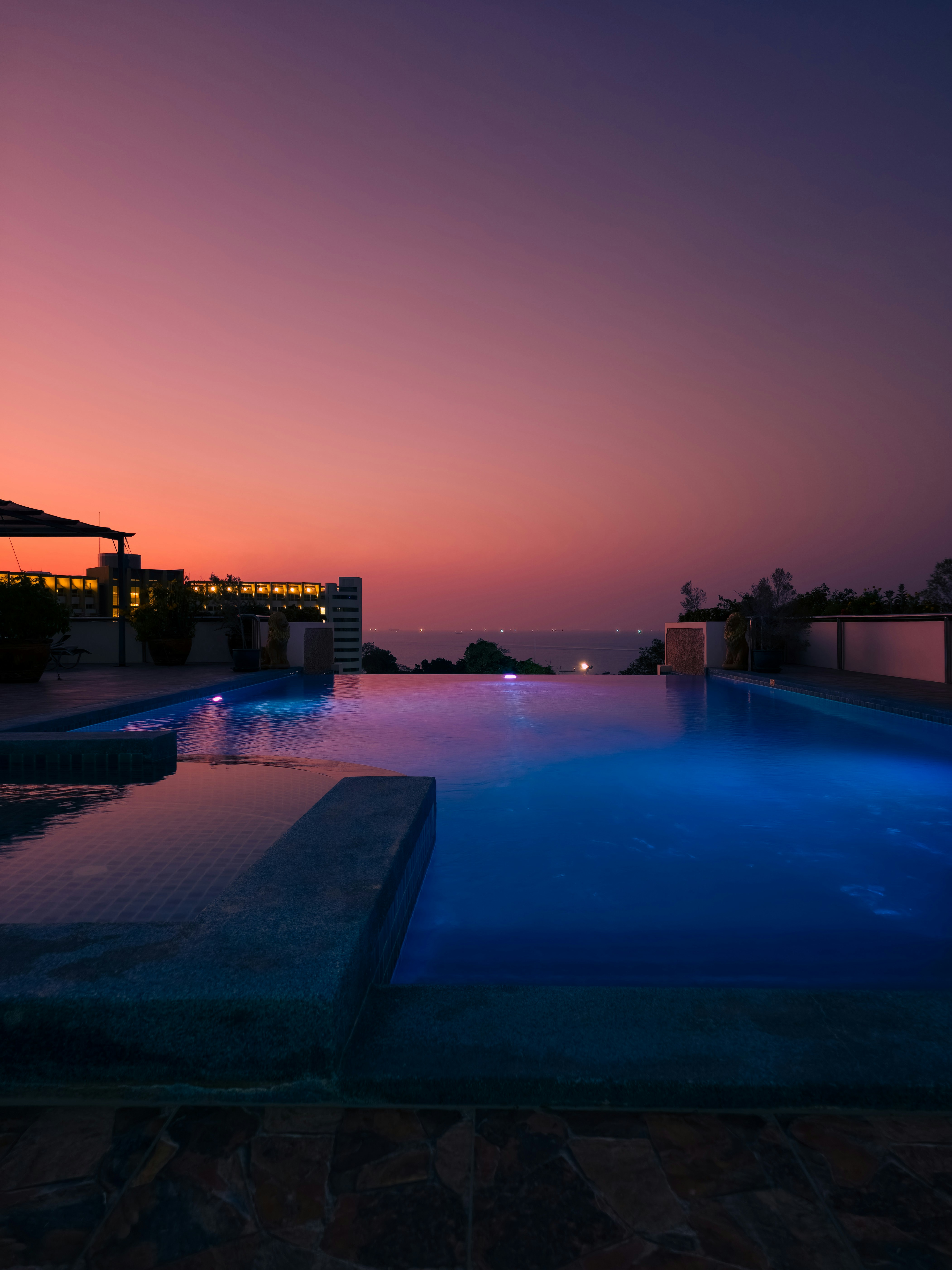 Infinity pool overlooking the ocean at sunset