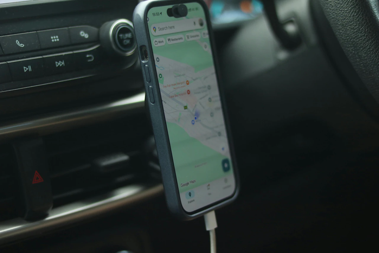 A phone running turn-by-turn navigation mounted in a delivery vehicle, following a sequenced route