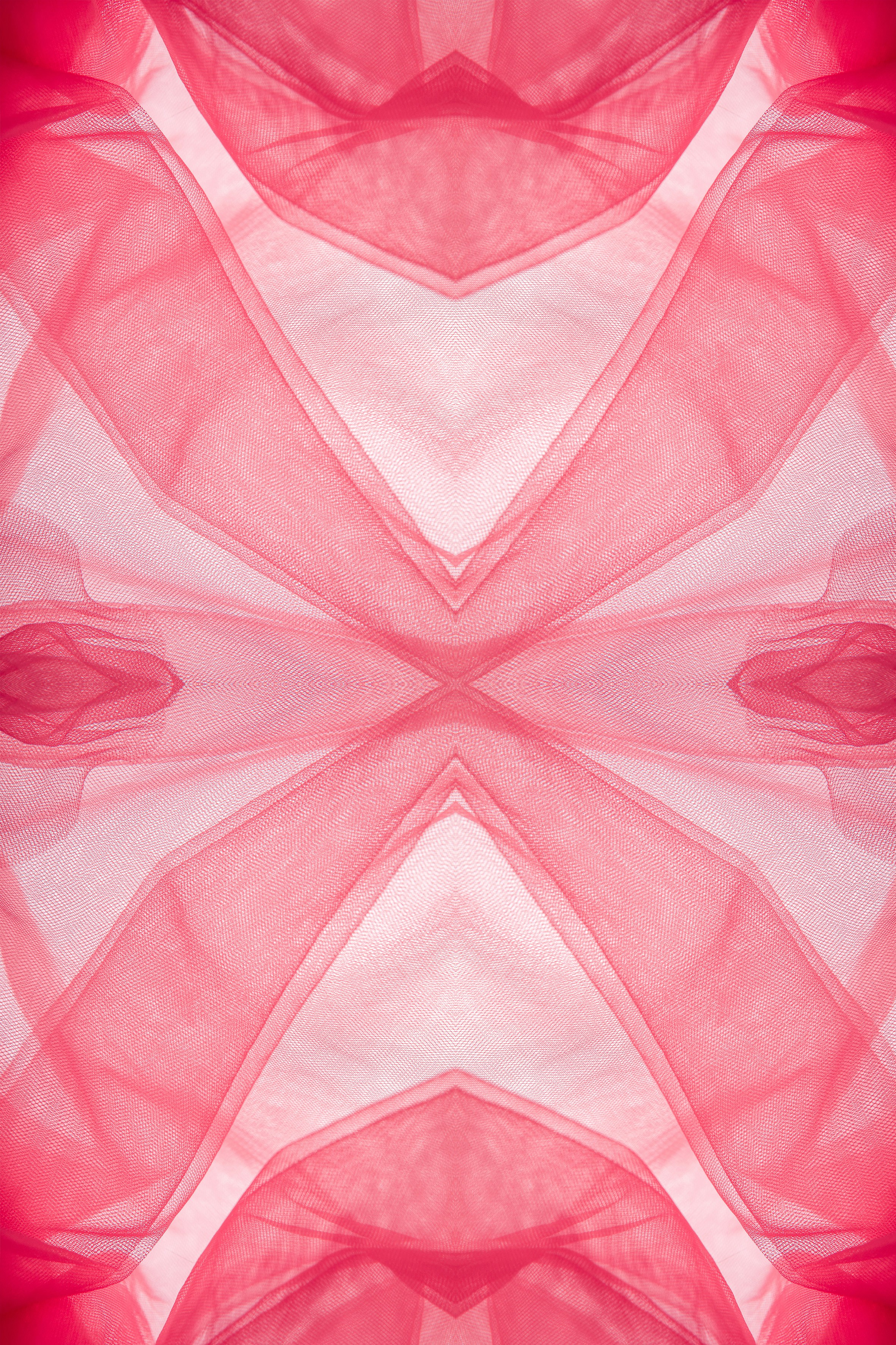 Abstract pattern of flowing pink fabric